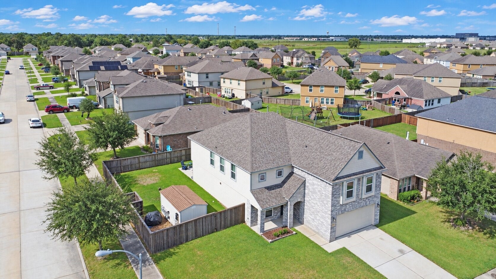 Spacious corner lot showcasing a brand-new roof with a 50-year transferable warrantylasting value for your next chapter.