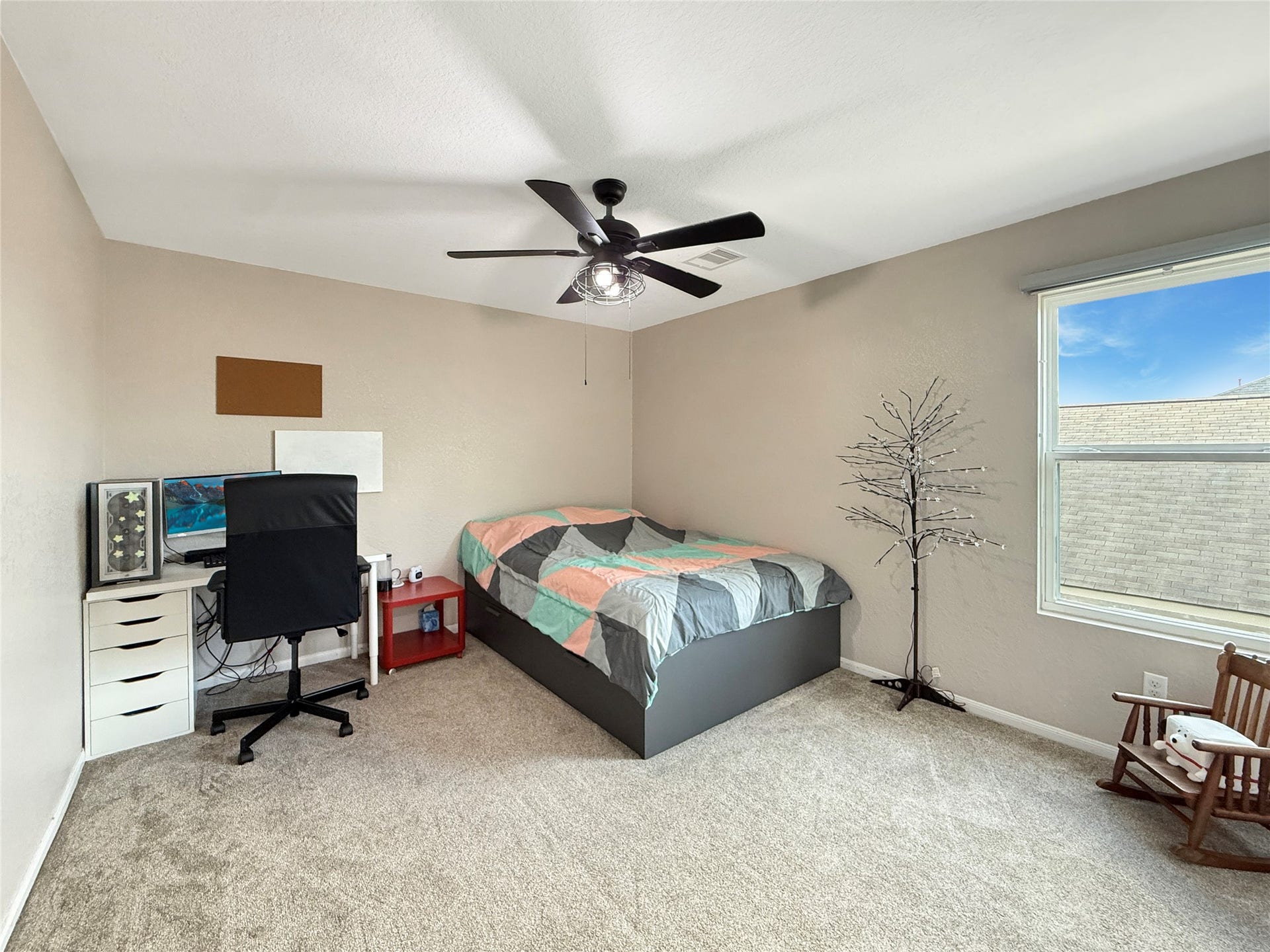 Upstairs secondary bedrooms offer comfortable space to rest, recharge, and make your own.