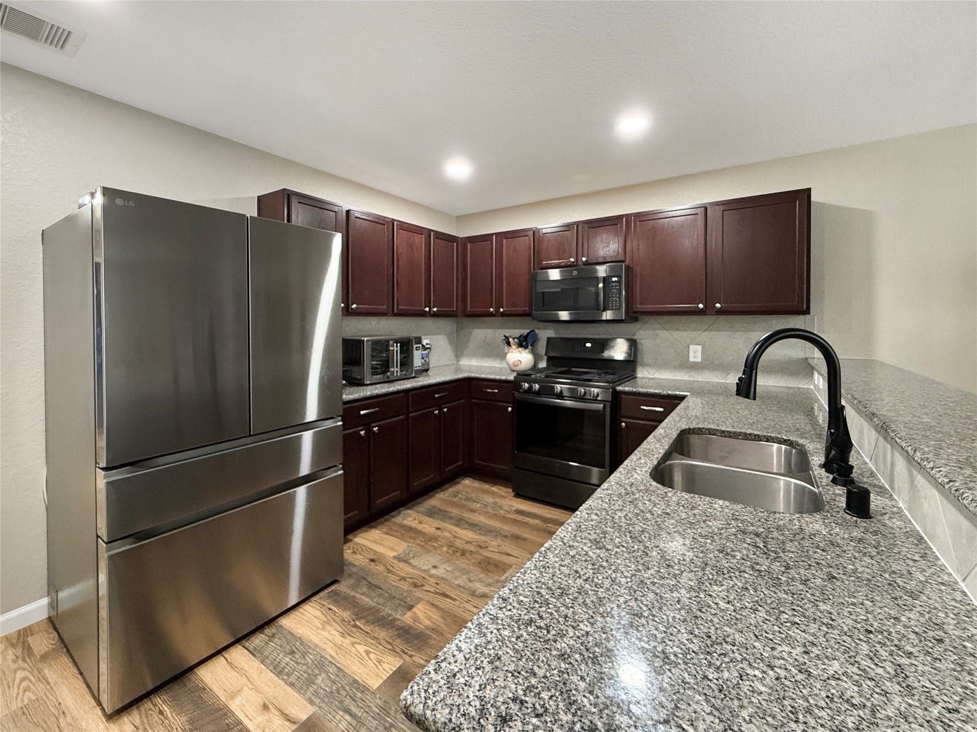 Kitchen with ample counter space opens to the living area, keeping you connected while preparing meals or entertaining.