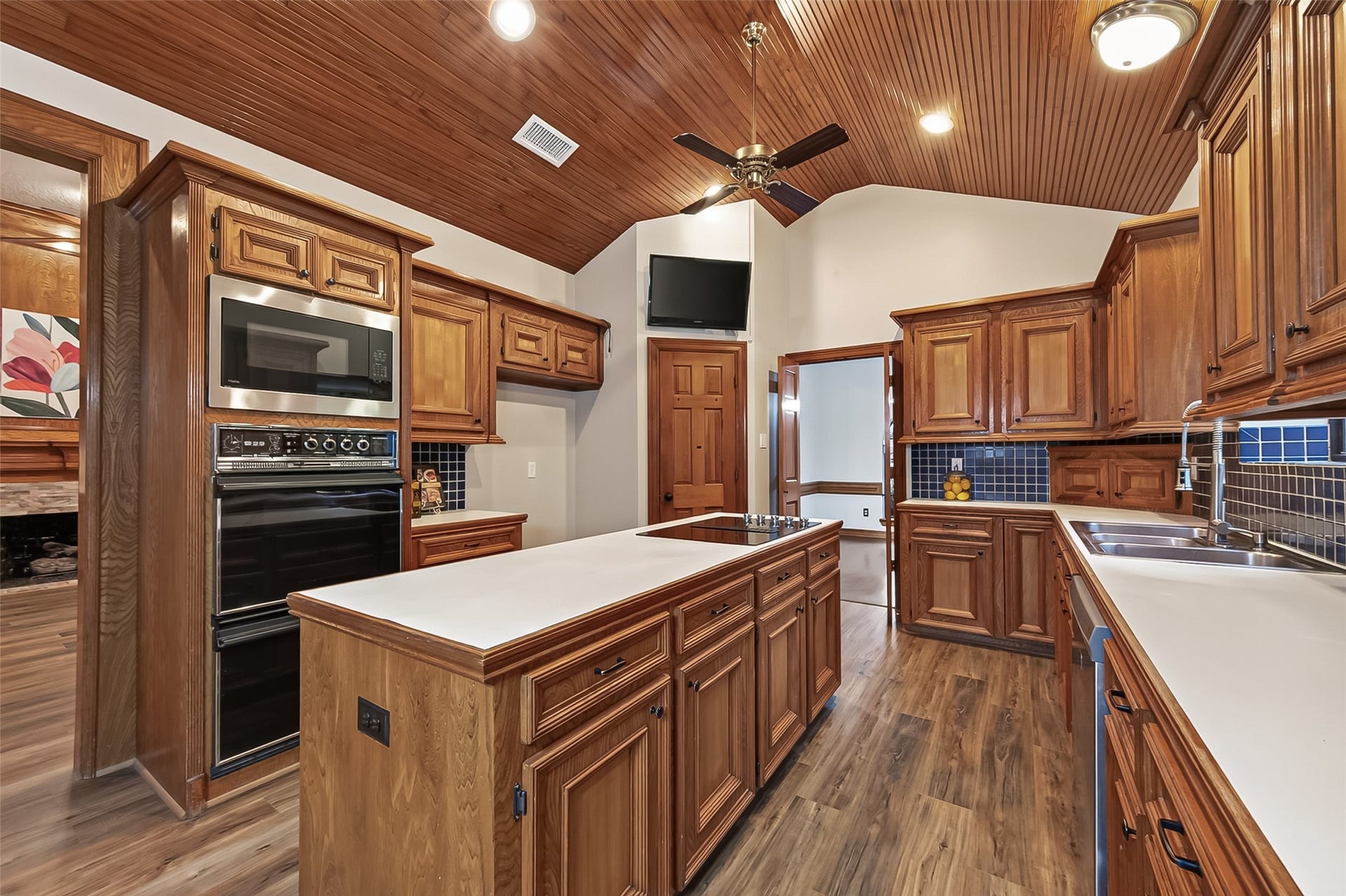 1410 Briar Green Court, Richmond, TX 77406 Large Island Kitchen with double ovens and custom woodwork on the ceiling.