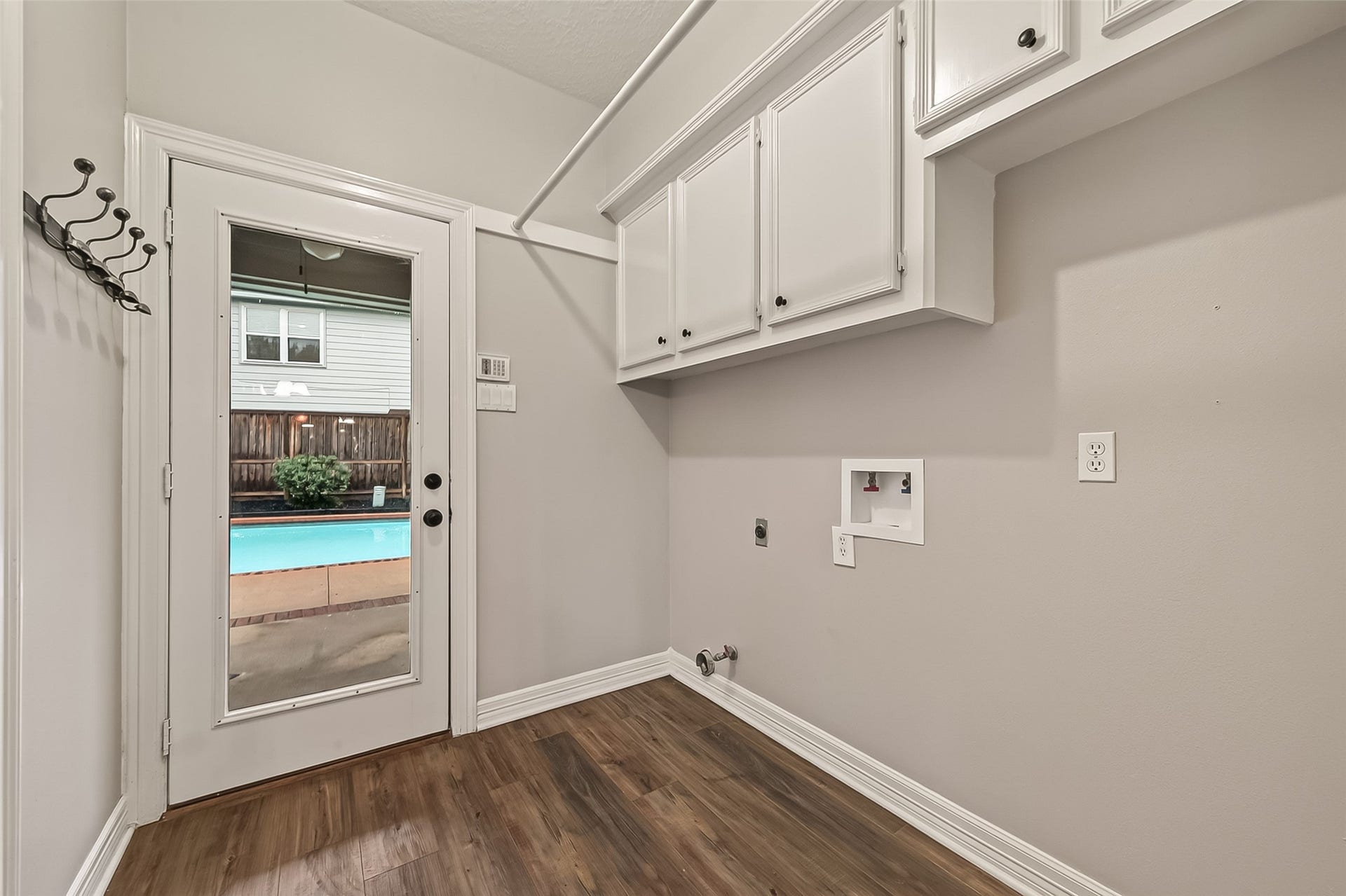 1410 Briar Green Court, Richmond, TX 77406 Large utility Room with a 1/2 bathroom that is easily accessible near the pool area!