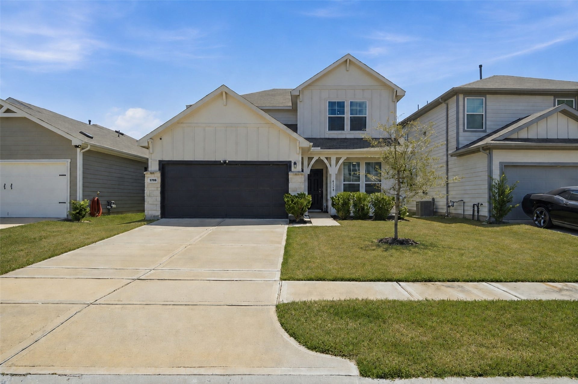 The modern farmhouse exterior creates amazing curb appeal.