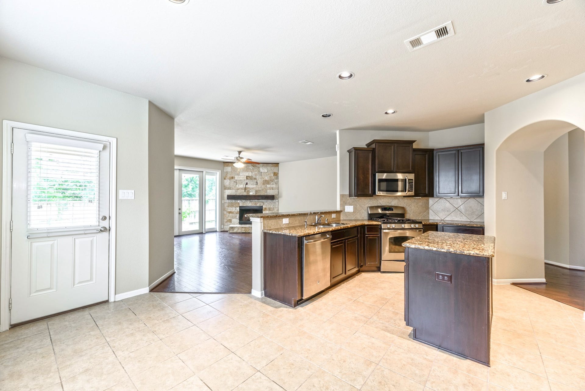 202 Black Swan Place, Magnolia, TX 77354 View from the breakfast room looking into the open floor plan of the kitchen and living room.