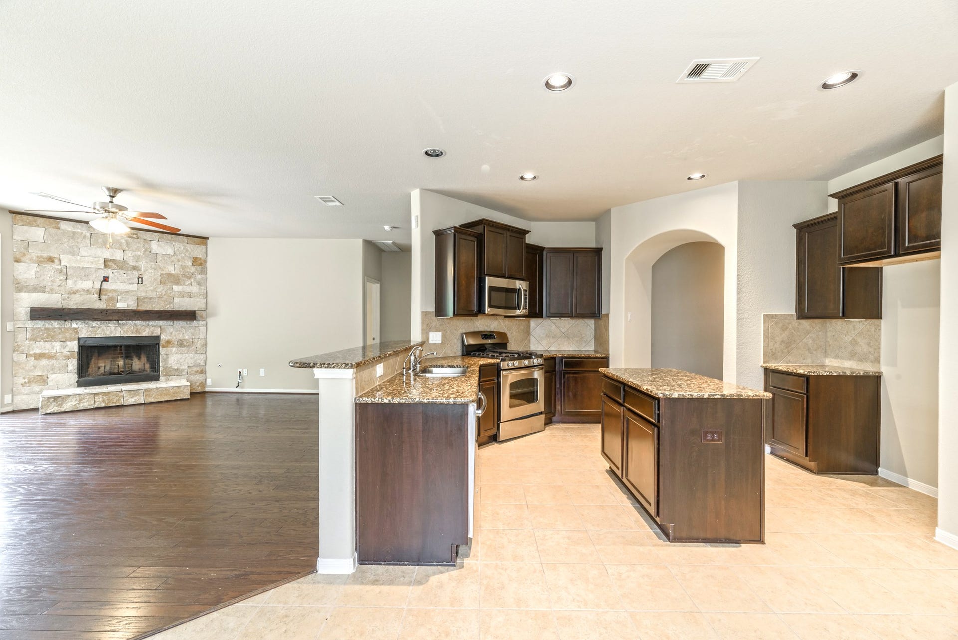 202 Black Swan Place, Magnolia, TX 77354 From the tiled breakfast room, you have a great view of the fireplace and kitchen.