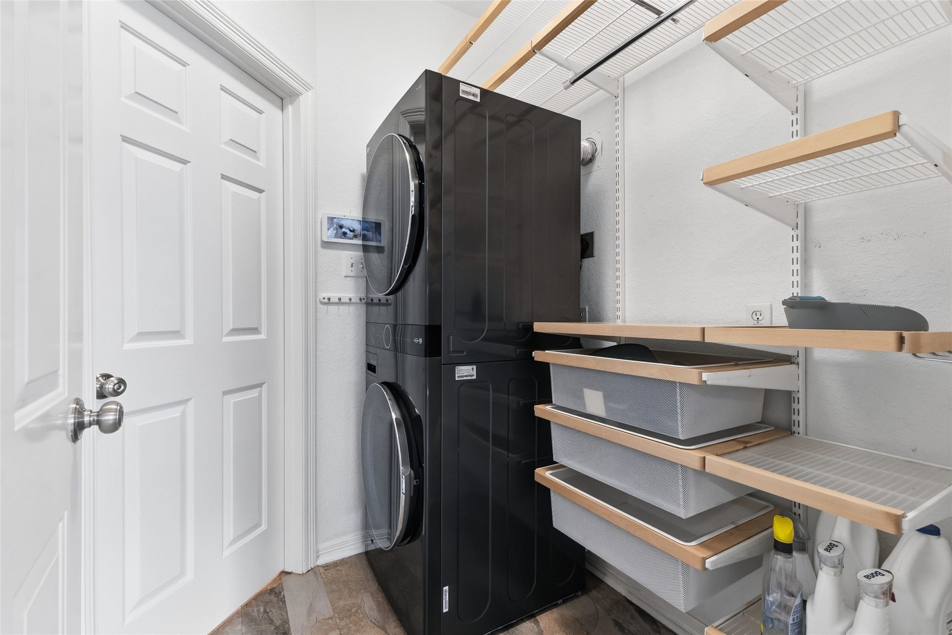 15314 Ledgewood Park Drive, Cypress, TX 77429 Functional laundry room with custom storage unit.