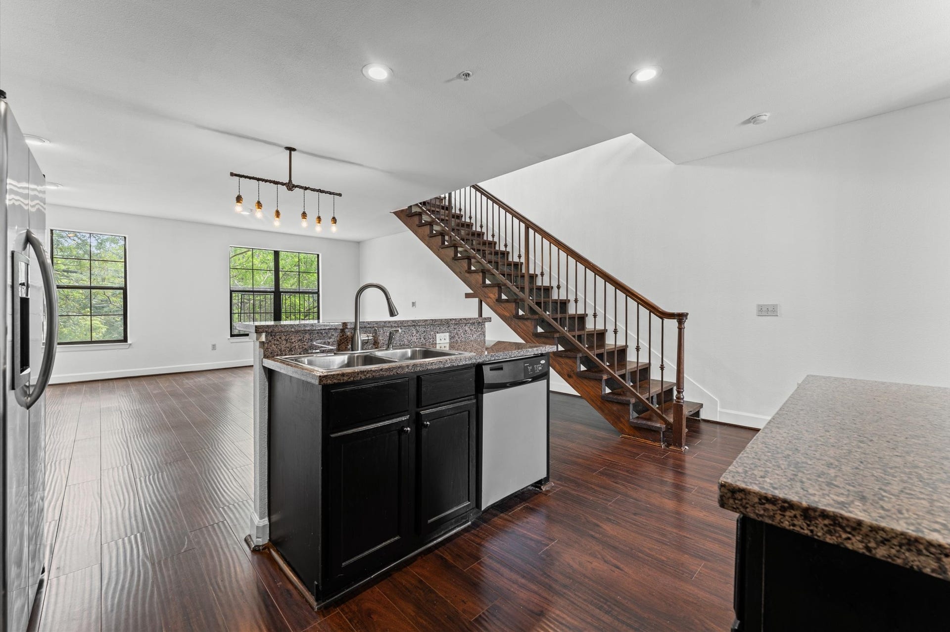 1602 Elgin Street, #10, Houston, TX 77004 The kitchen and living areas connect seamlessly, creating a comfortable, open feel throughout the unit's first floor.