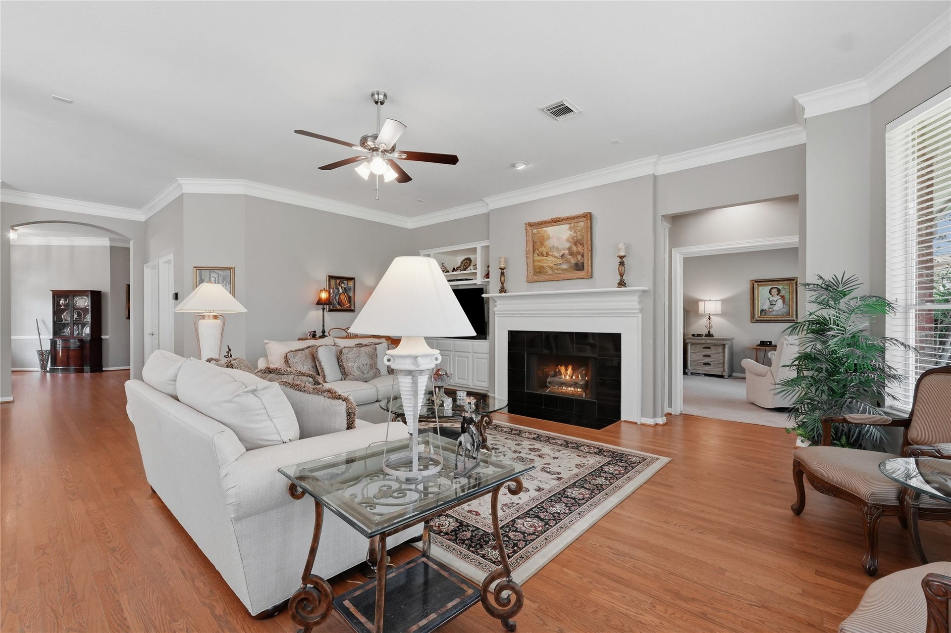 11839 Catrose Lane, Cypress, TX 77429 Notice the wood flooring and crown molding continues through the living room.