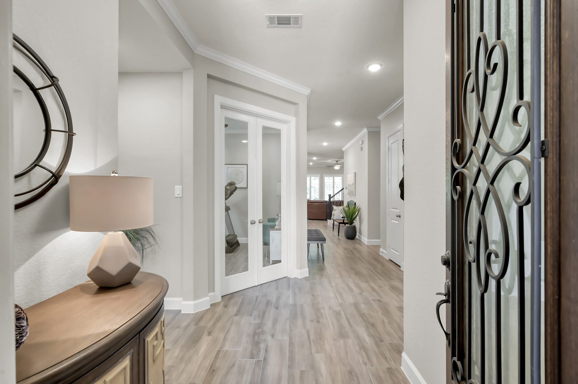 Welcoming entry with wood-look flooring, neutral tones, bright, open, and inviting from the moment you step inside.