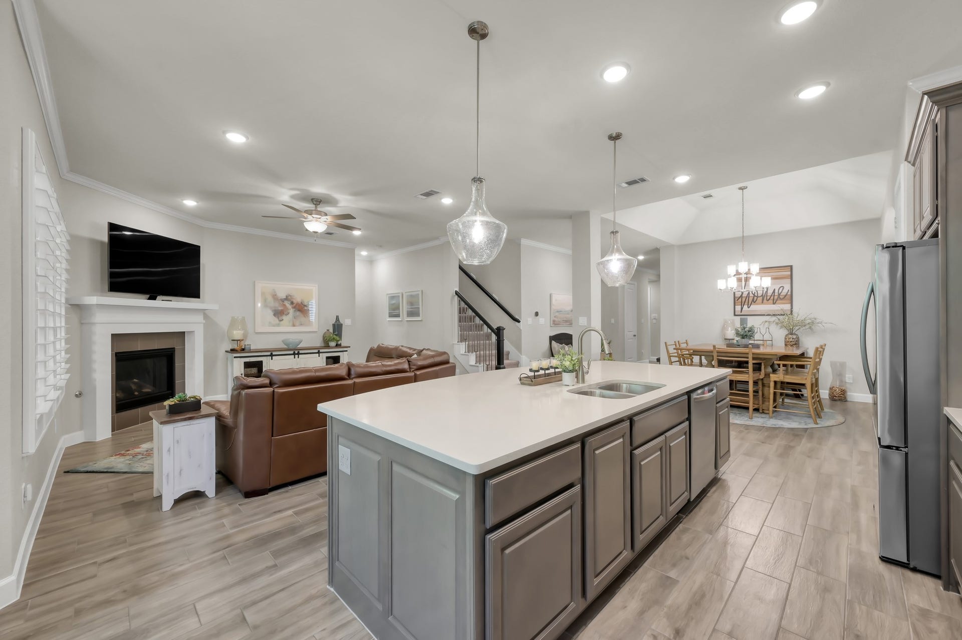 Open-concept living with seamless flow from kitchen to family room.