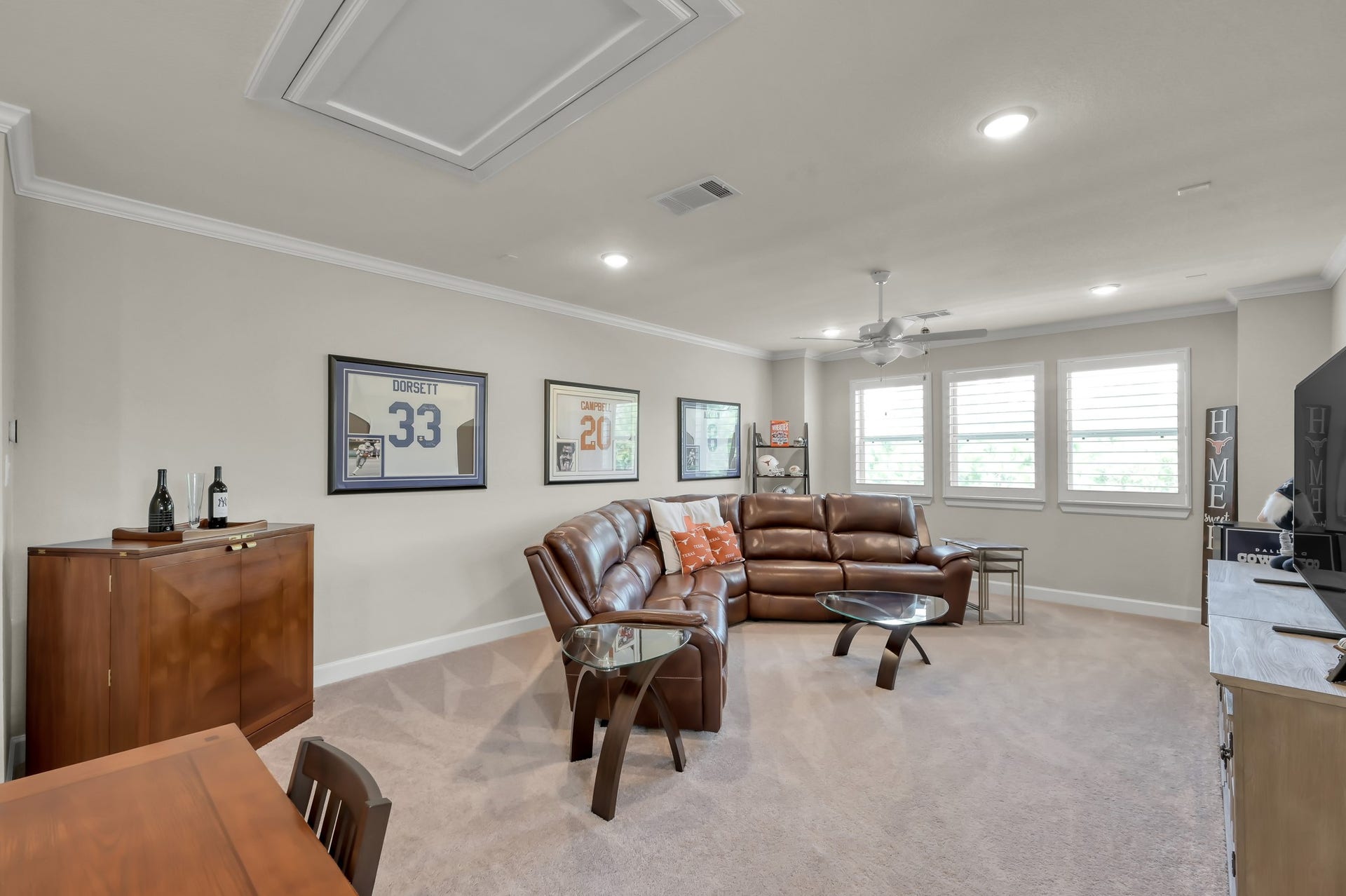 Spacious upstairs game room with abundant natural light and versatile layoutperfect for entertaining, media, or play space.