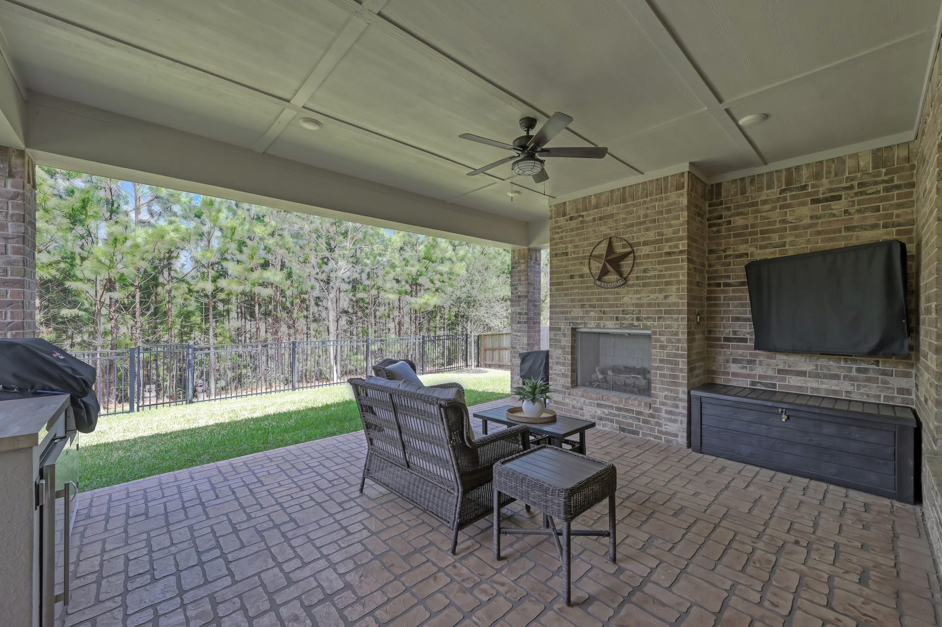 Covered brick patio with wood burning fireplace on a premium reserve lot!