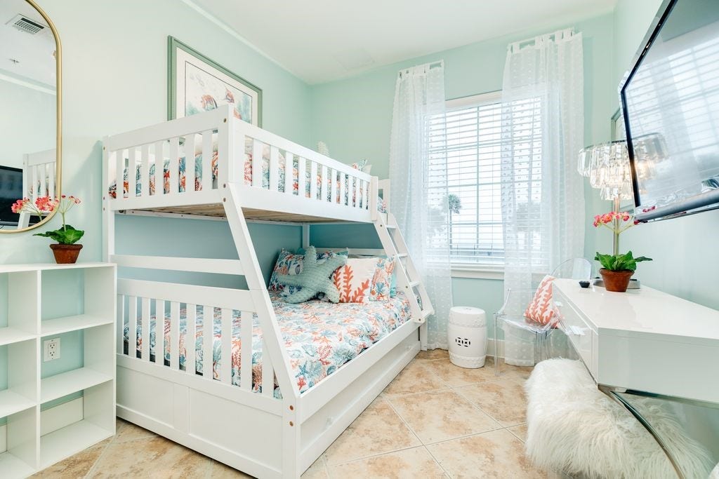 10327 Termini San Luis Pass Road, #218, Galveston, TX 77554 One of two secondary bedrooms with bunk beds and room for a desk