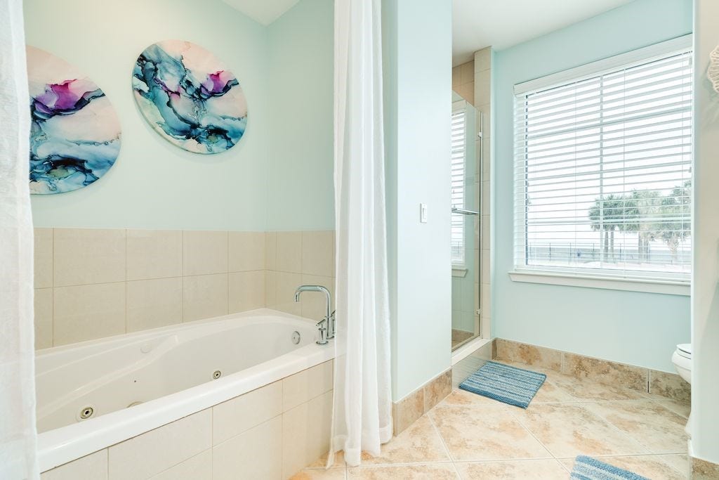 10327 Termini San Luis Pass Road, #218, Galveston, TX 77554 Primary bathroom with tub and separate shower