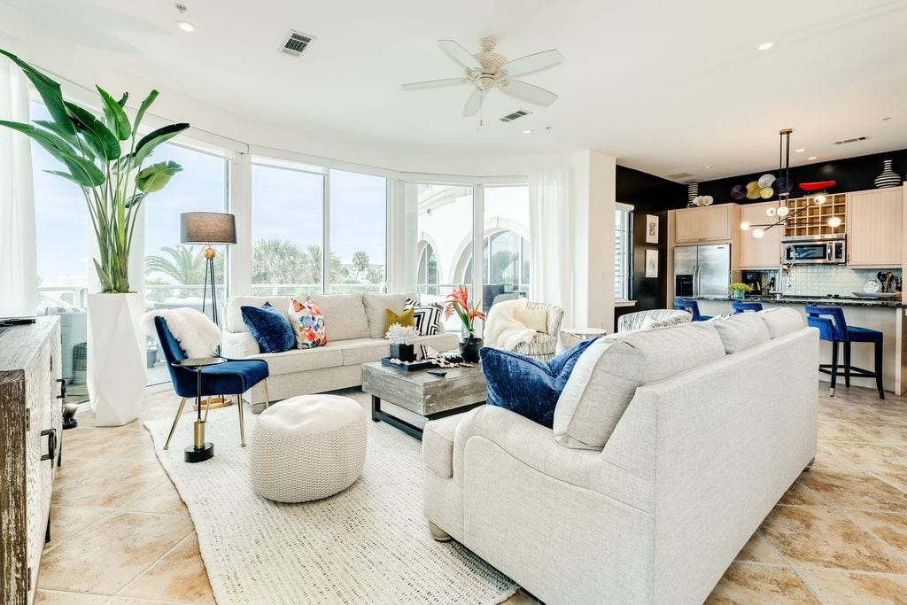 10327 Termini San Luis Pass Road, #218, Galveston, TX 77554 Living area with wall of curved windows with access to large balcony