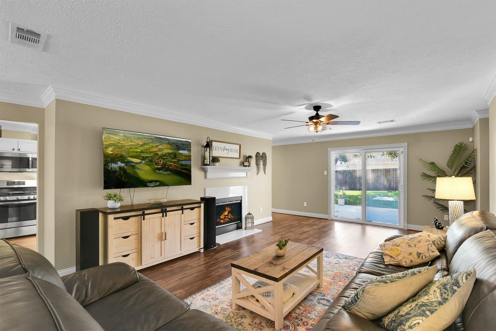 18703 Timbers Trace Drive, Humble, TX 77346 Spacious living room with gas log fireplace.