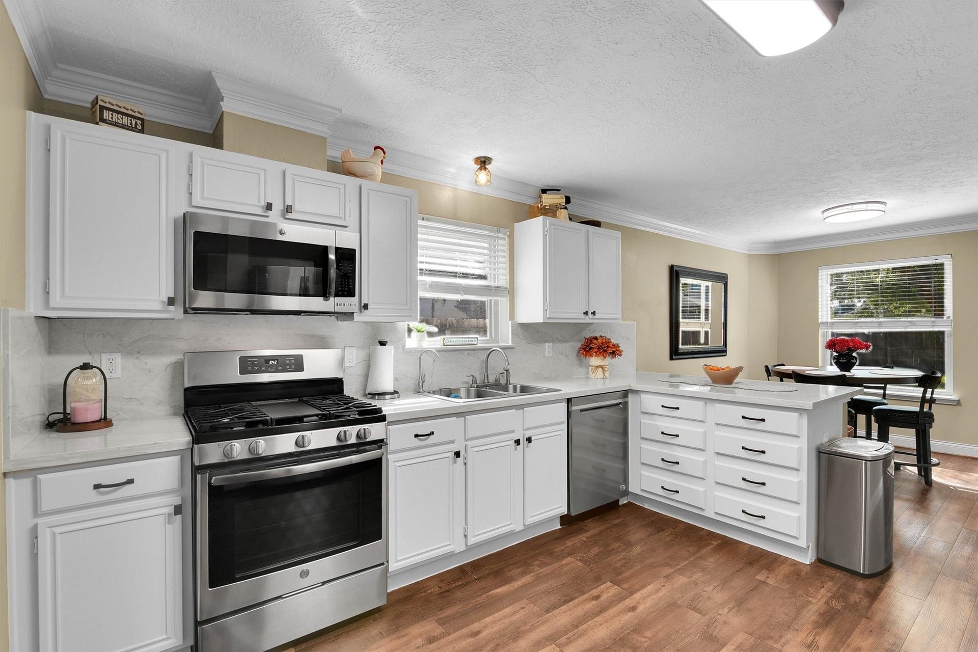 18703 Timbers Trace Drive, Humble, TX 77346 Gas range, eat-in bar, and kitchen nook.