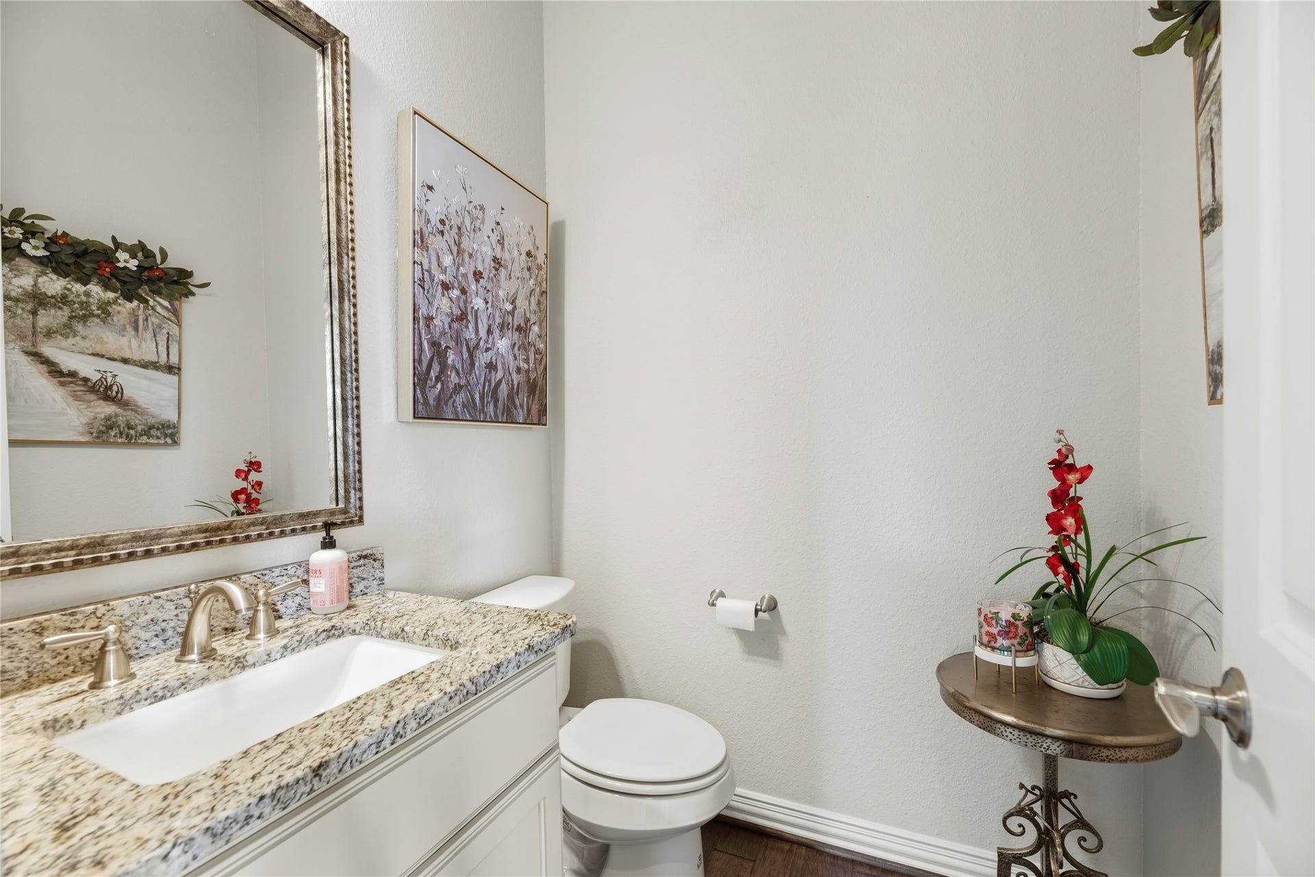 17922 Olde Oaks Estate Court, Cypress, TX 77433 The downstairs half bathroom featuring a vanity with a granite countertop.