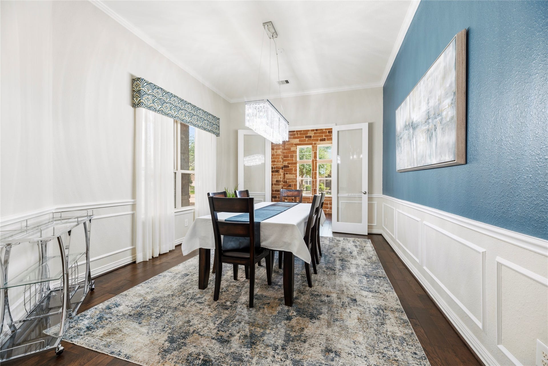 17922 Olde Oaks Estate Court, Cypress, TX 77433 A magnificent chandelier hangs in the spacious formal dining room with crown molding.