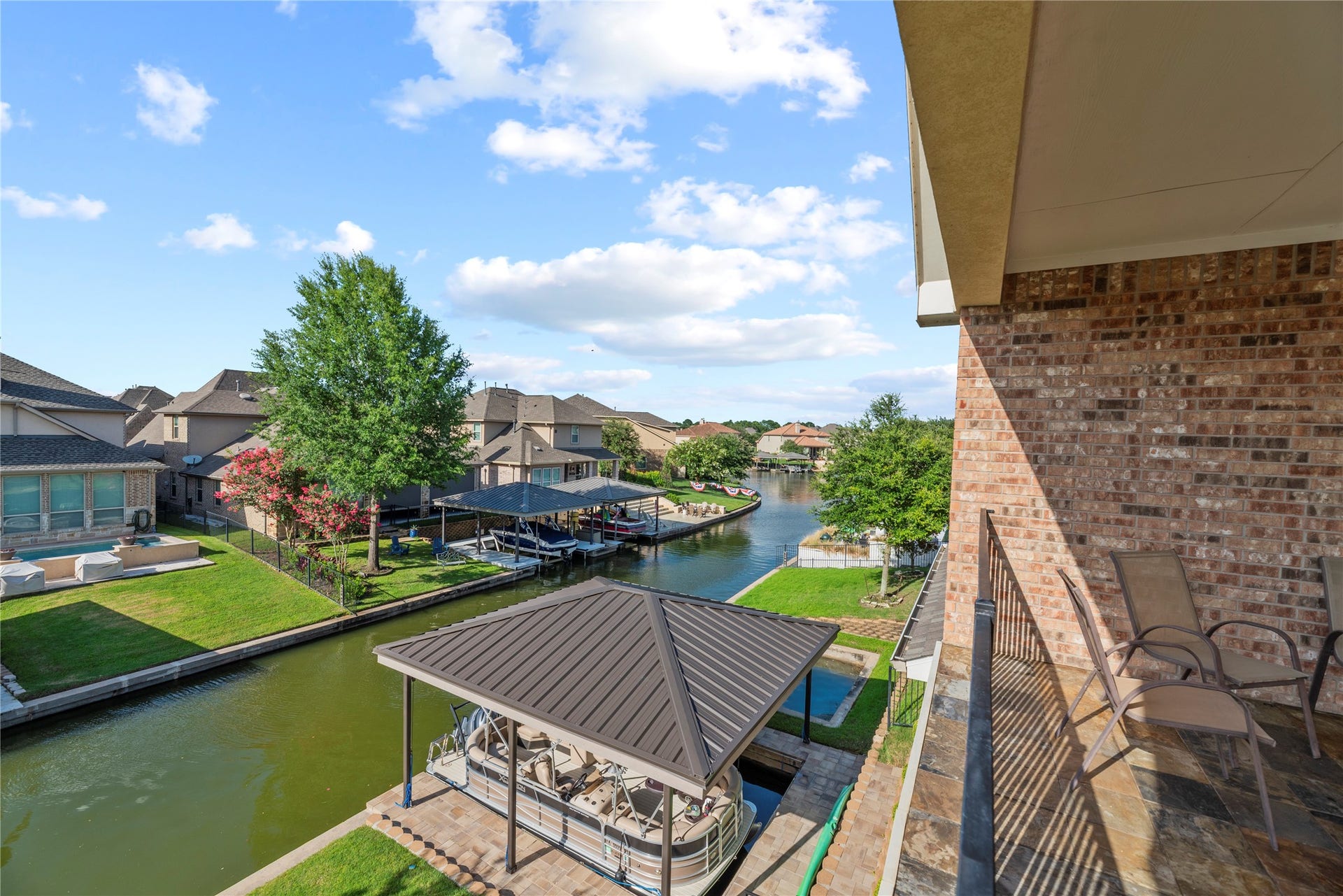 17922 Olde Oaks Estate Court, Cypress, TX 77433 From the balcony, the views of the canal are unobstructed.