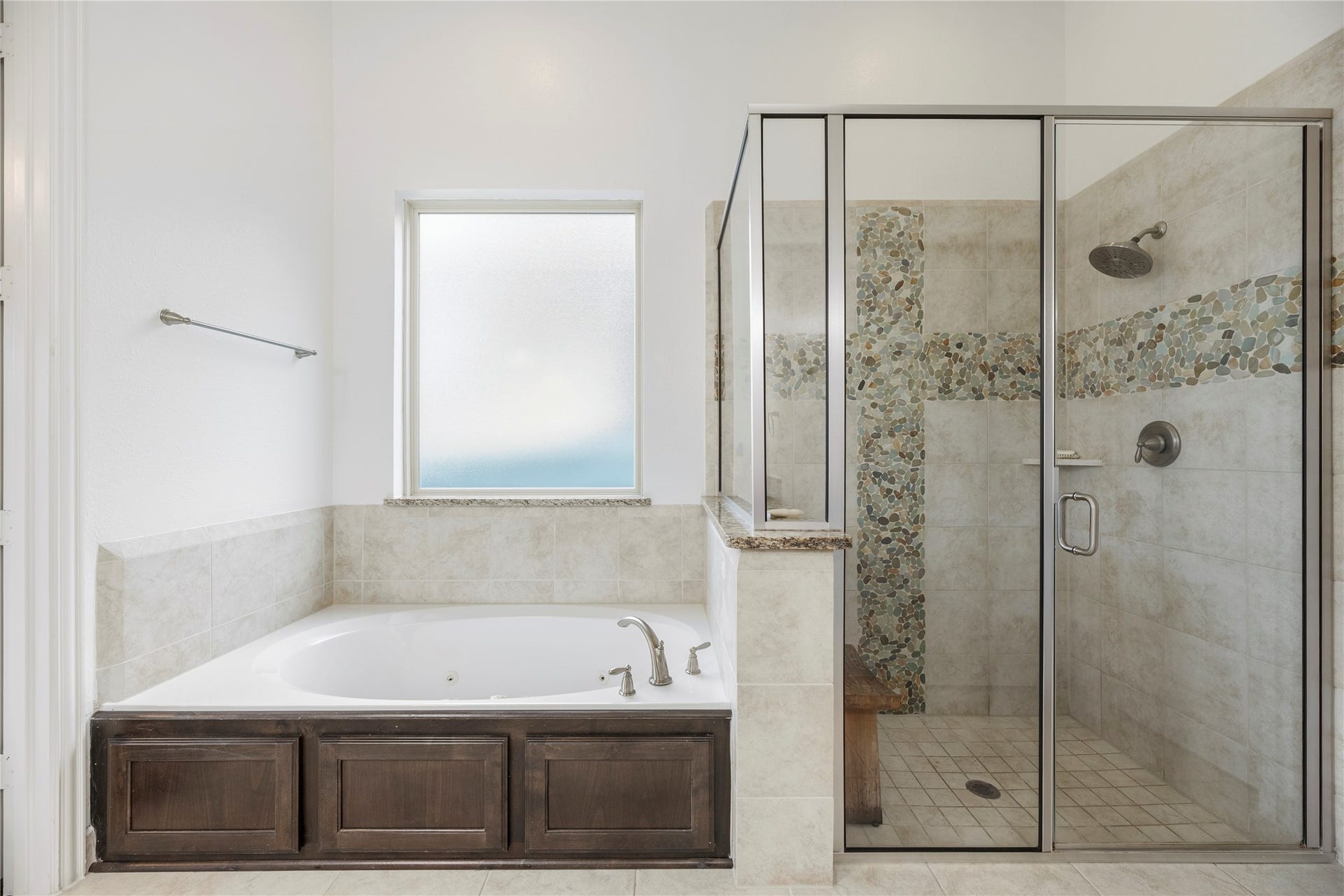 17922 Olde Oaks Estate Court, Cypress, TX 77433 The primary bath features a perfect mix of tile and stone finishes.