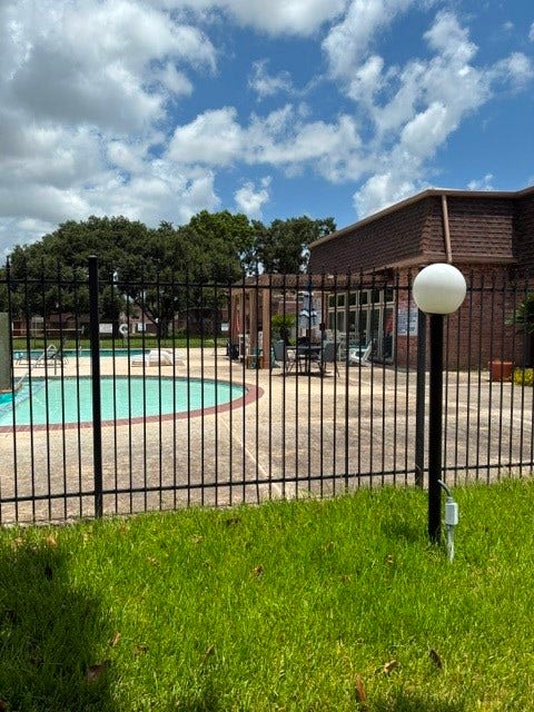 2917 Nottingham Lane, Missouri City, TX 77459 View of the pool and the clubhouse.