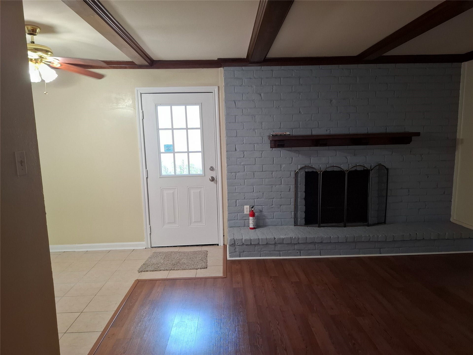 2917 Nottingham Lane, Missouri City, TX 77459 Part of the Den, with a wooden fIreplace.