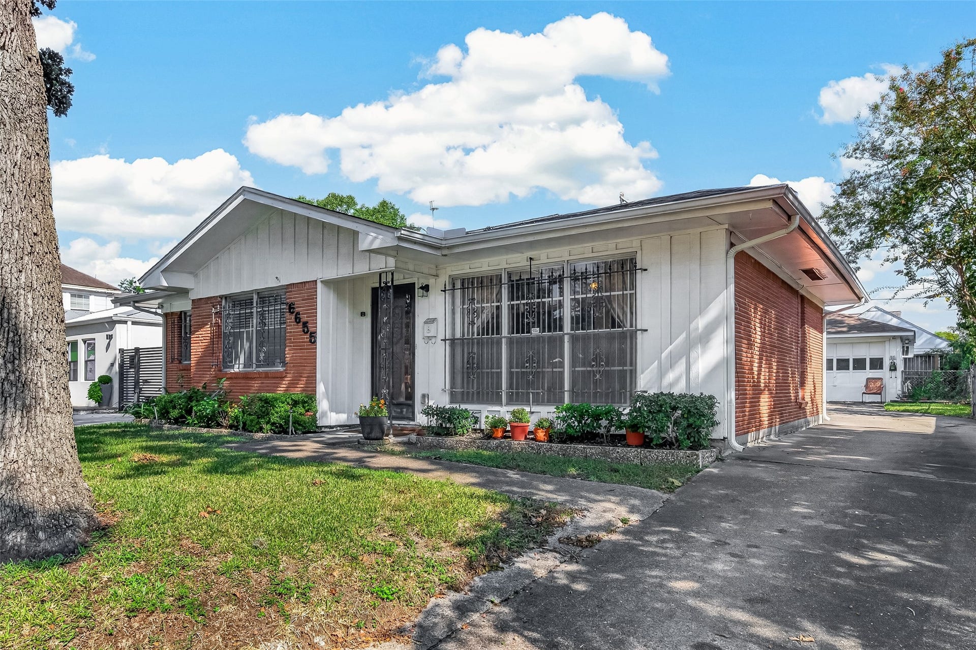 6655 Wildwood Way, Houston, TX 77023 Double detached garage. Iron bars can be removed,owner purchased the house with Wrought Iron Installed.
