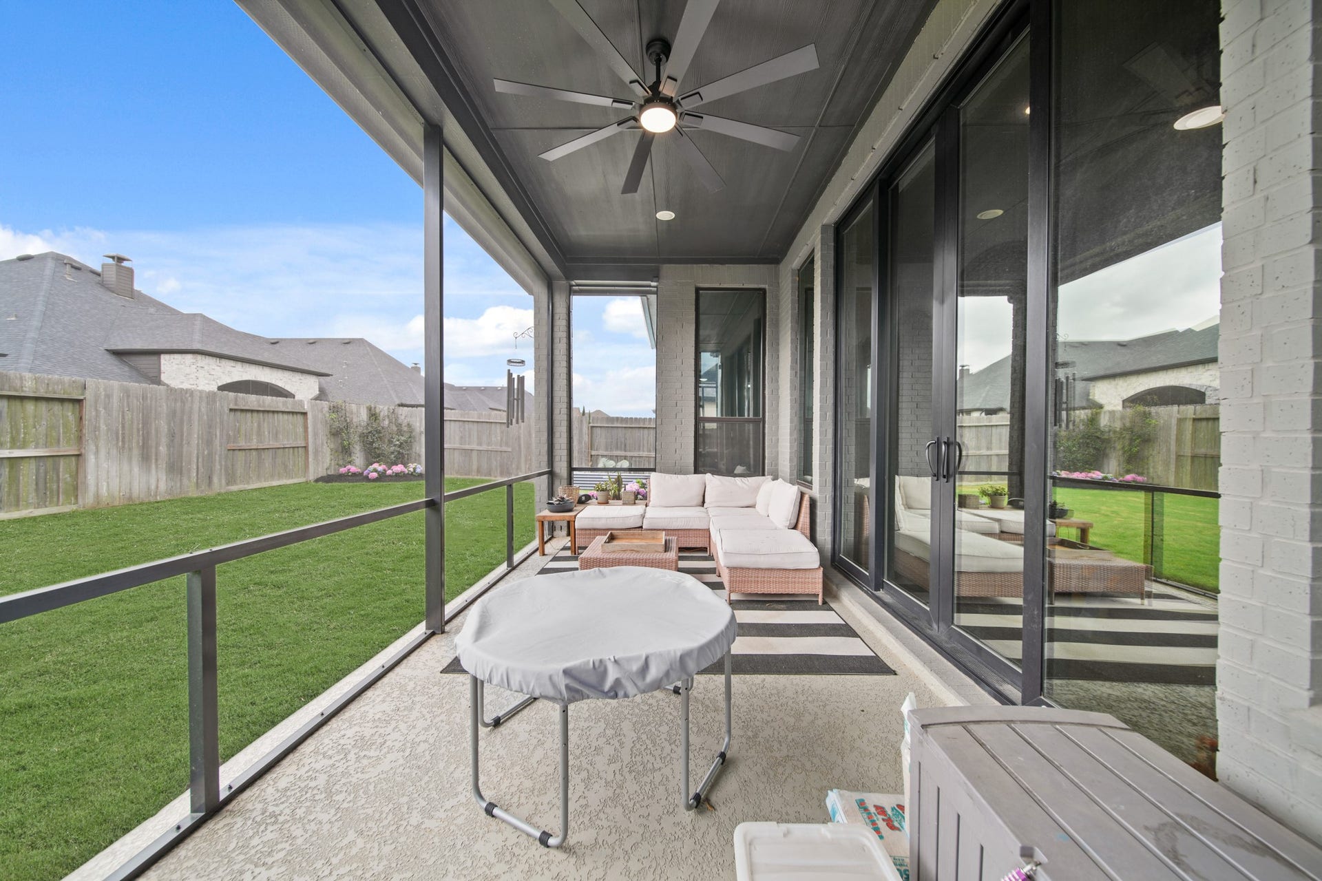 Spacious fully screened patio which connects to the family room as well as the outdoor kitchen.