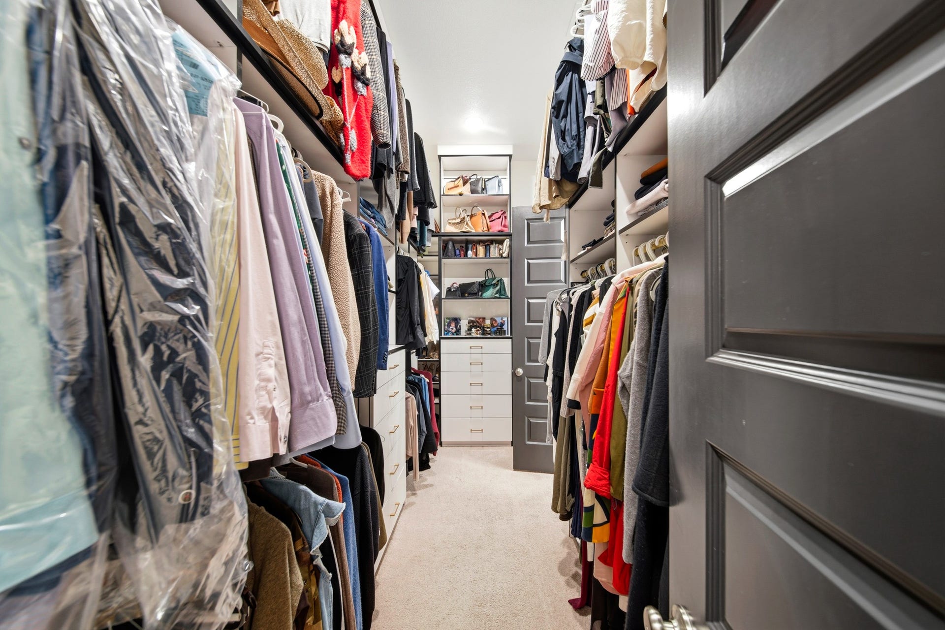 Oversized custom primary closet with double entry points.