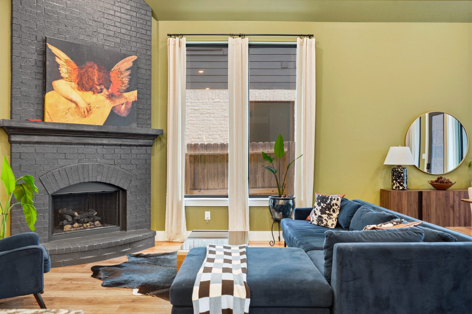 Living room with gas wood-burning fireplace.