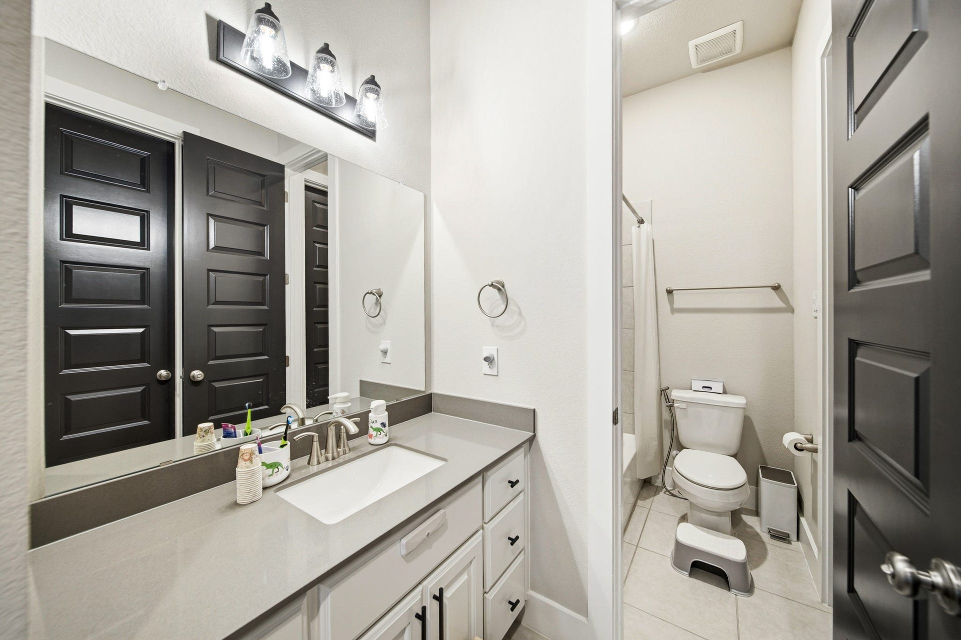 Vanity connected to Secondary bedroom #1. Tub/shower combo and toilet connect the two vanities.