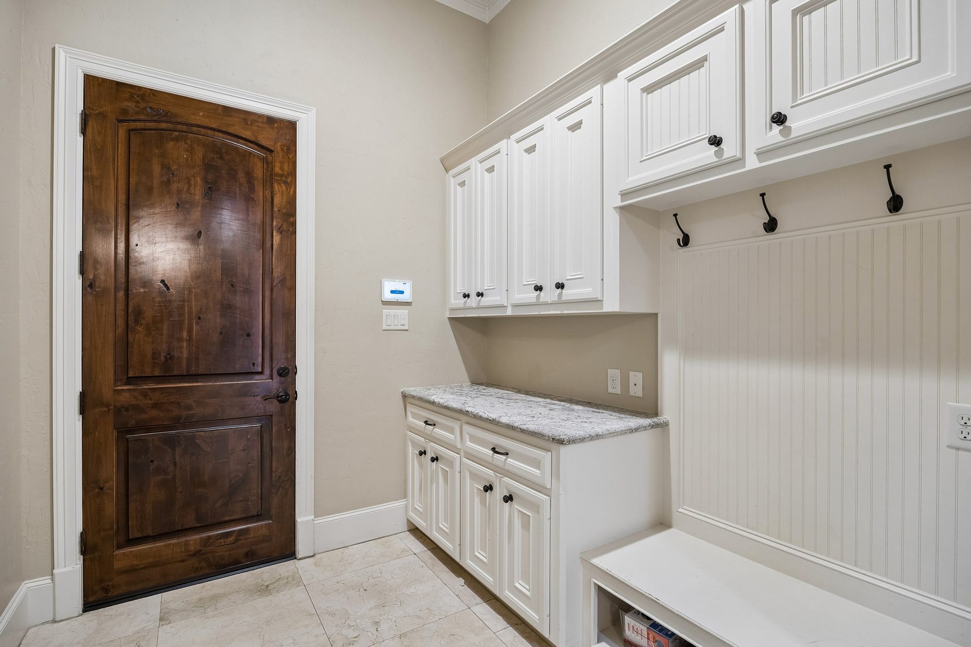 8111 Marshall Falls Drive, Spring, TX 77379 The mudroom is conveniently located off the 3 car-garage and is adjacent to the utility room and a second powder room.