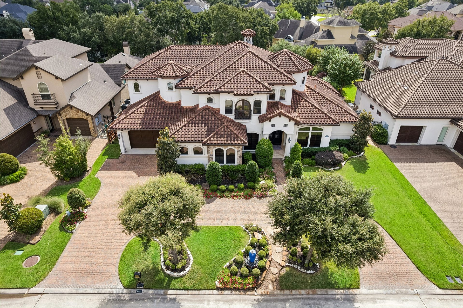 8111 Marshall Falls Drive, Spring, TX 77379 Ariel view of the grand estate, situated on an expansive 15,200 square foot lot.
