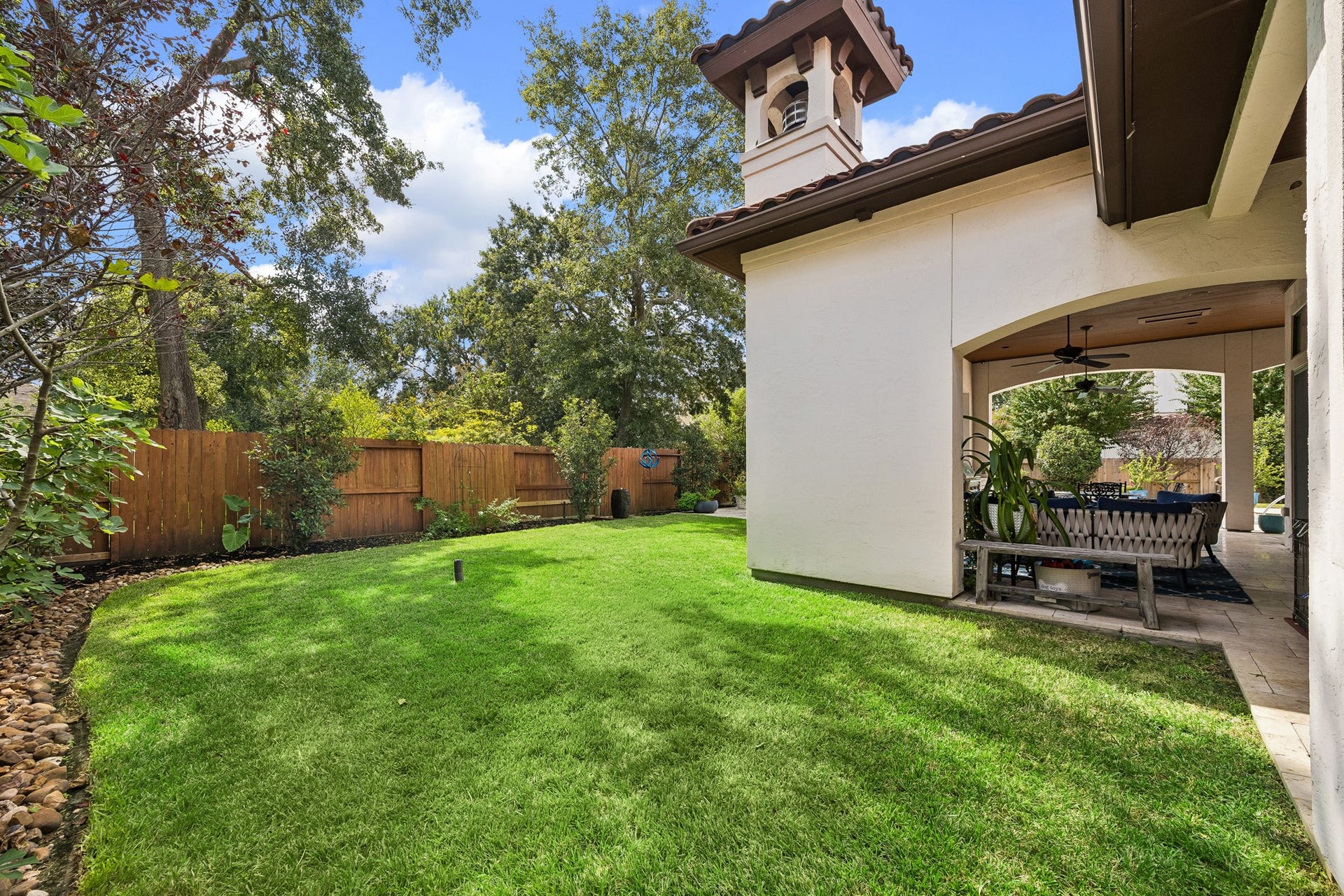 8111 Marshall Falls Drive, Spring, TX 77379 Extra green space adjacent to the patio. Perfect for pets or play.