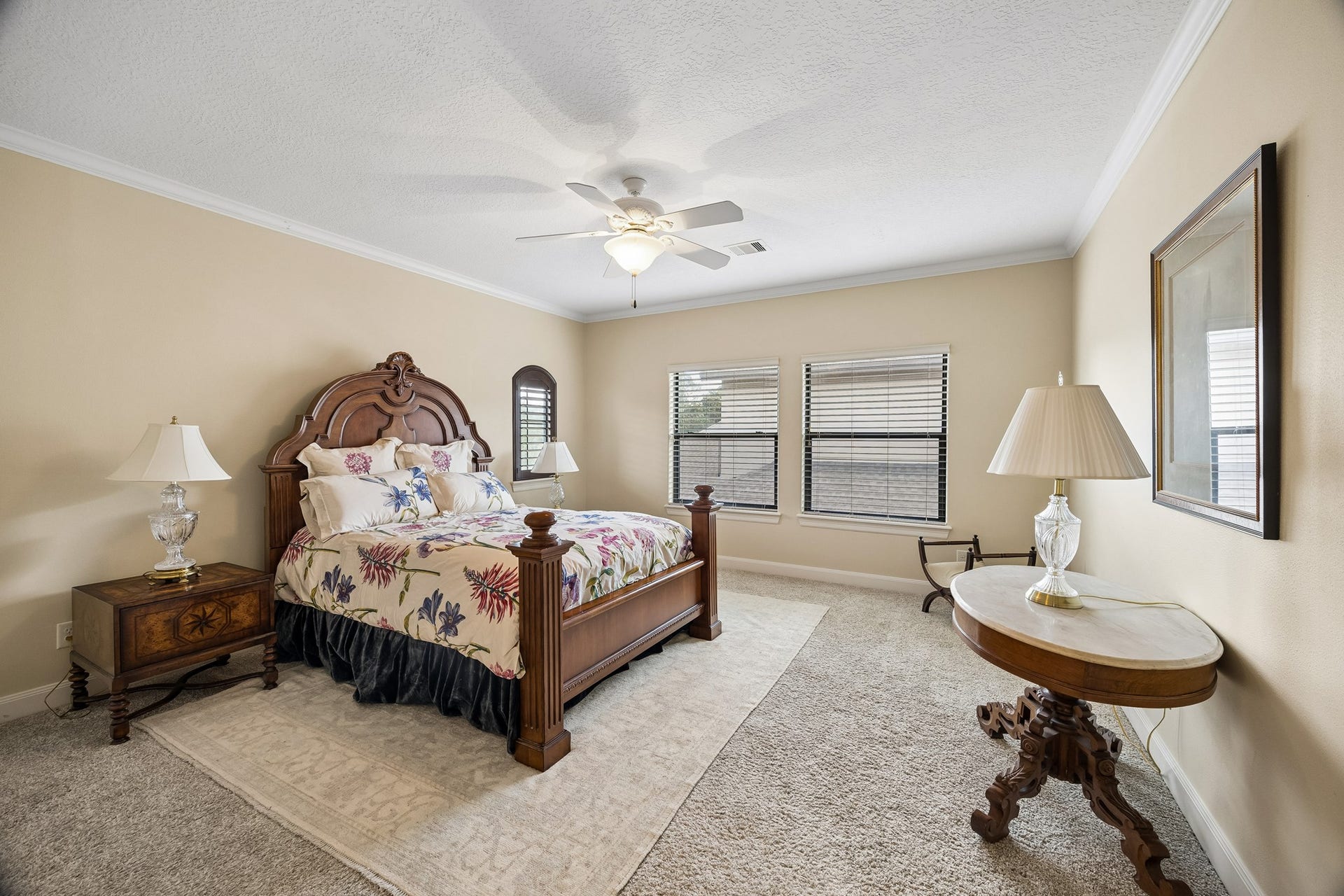 8111 Marshall Falls Drive, Spring, TX 77379 Spacious second floor en-suite bedroom featuring plush carpeting, and abundant natural light from multiple windows.