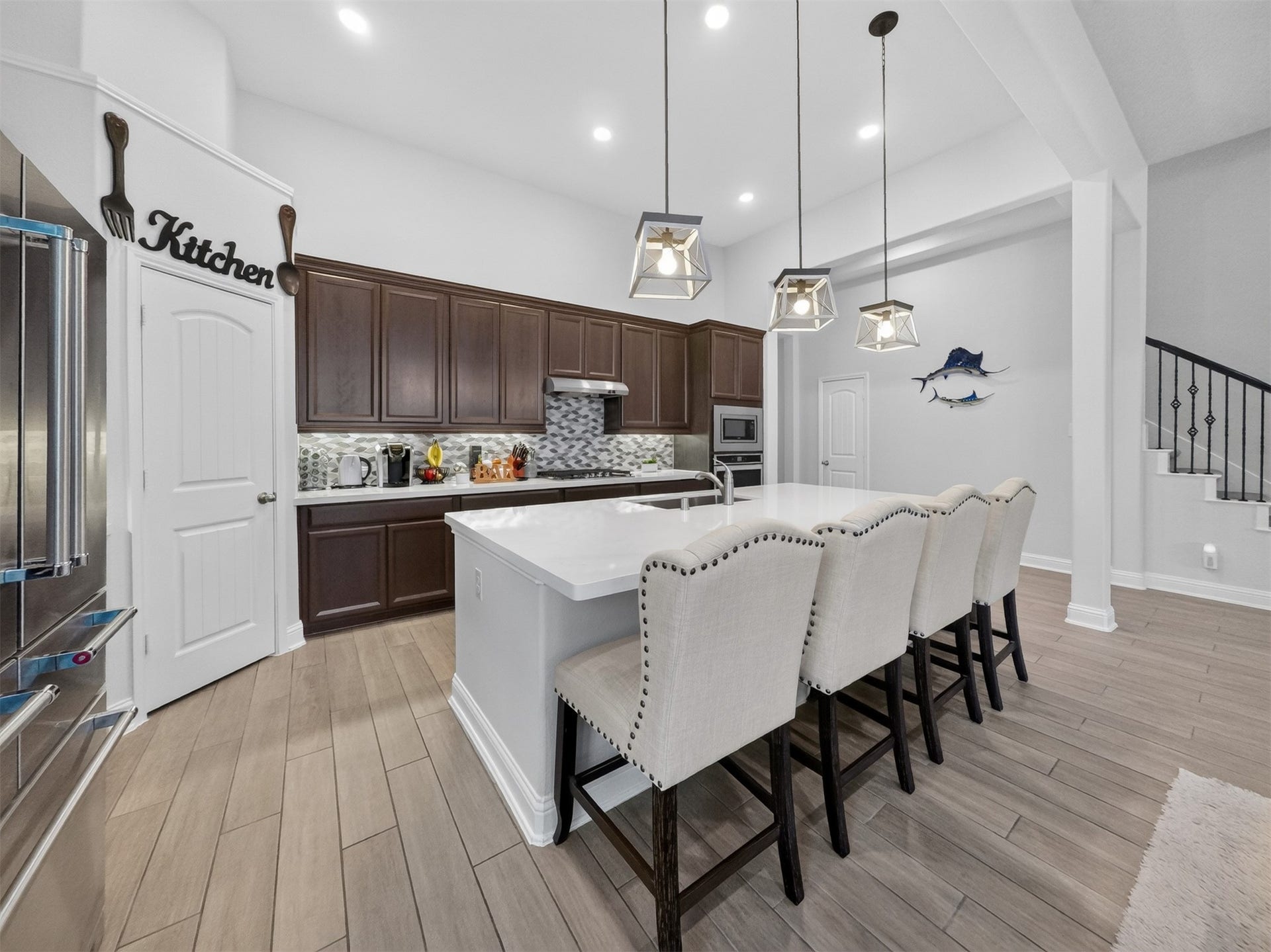 15419 Wilsons Snipe Court, Cypress, TX 77433 Plenty of room to prep, cook and serve with quartz counters, a large island, stainless appliances, gas cooking, generous cabinet storage and a good-size pant