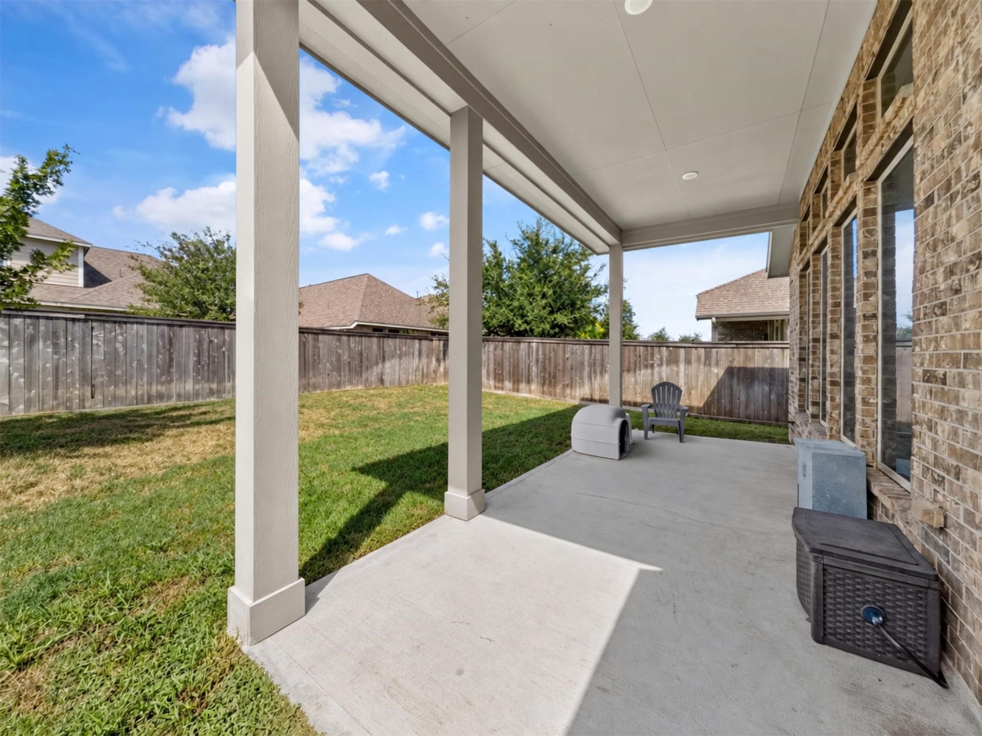 15419 Wilsons Snipe Court, Cypress, TX 77433 A substantial covered patio gives you usable outdoor space for seating and dining, with the backyard stretching out beyond it.