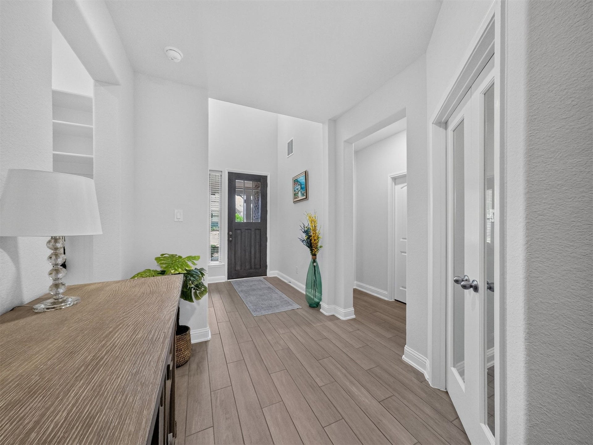 15419 Wilsons Snipe Court, Cypress, TX 77433 Entry with soaring ceilings, neutral colors and durable wood-look tile flooring that continues through the main living areas.