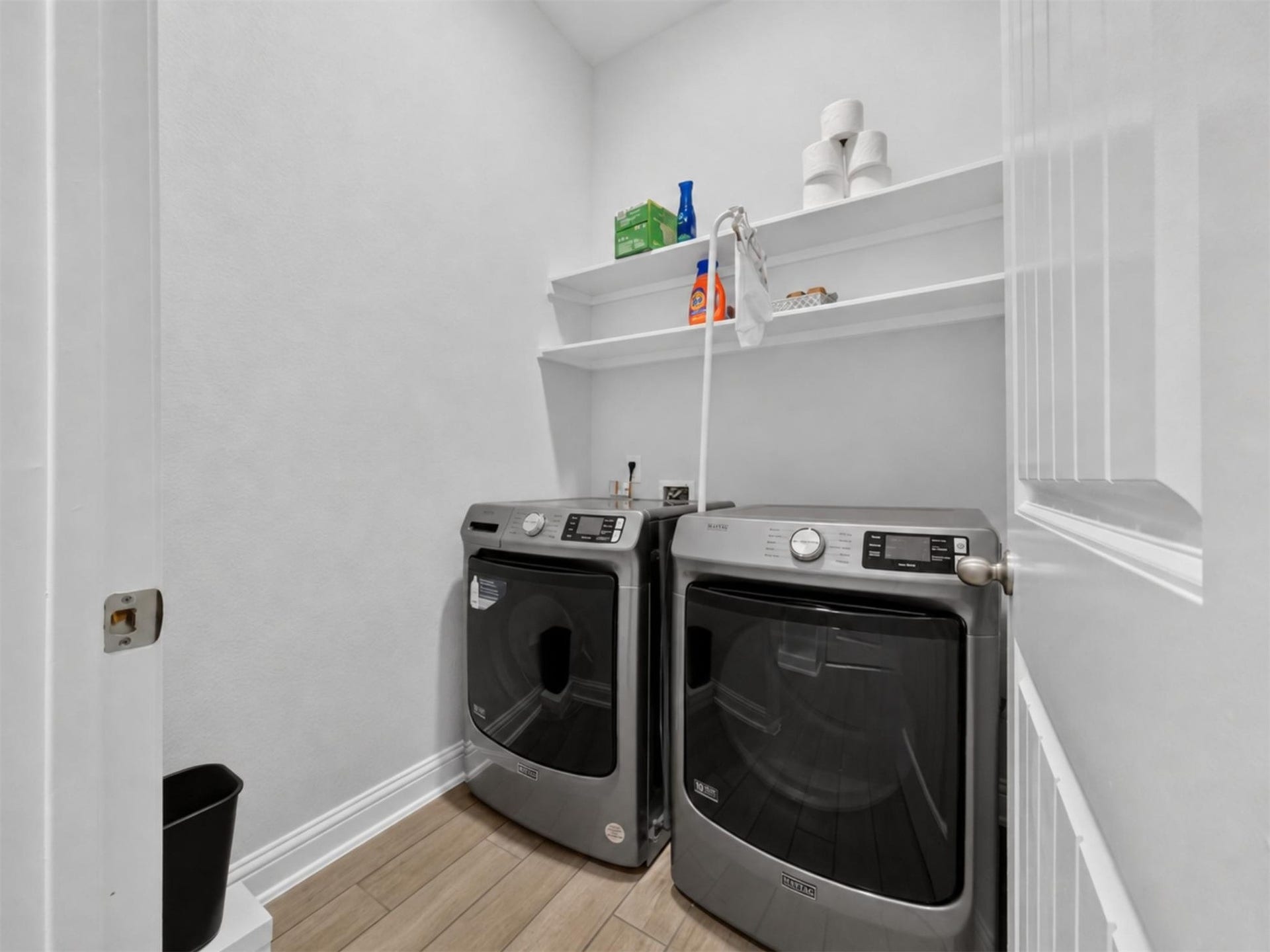 15419 Wilsons Snipe Court, Cypress, TX 77433 The first-floor utility room is conveniently located near the garage hallway with room for a full-size washer and dryer plus shelving for laundry supplies.