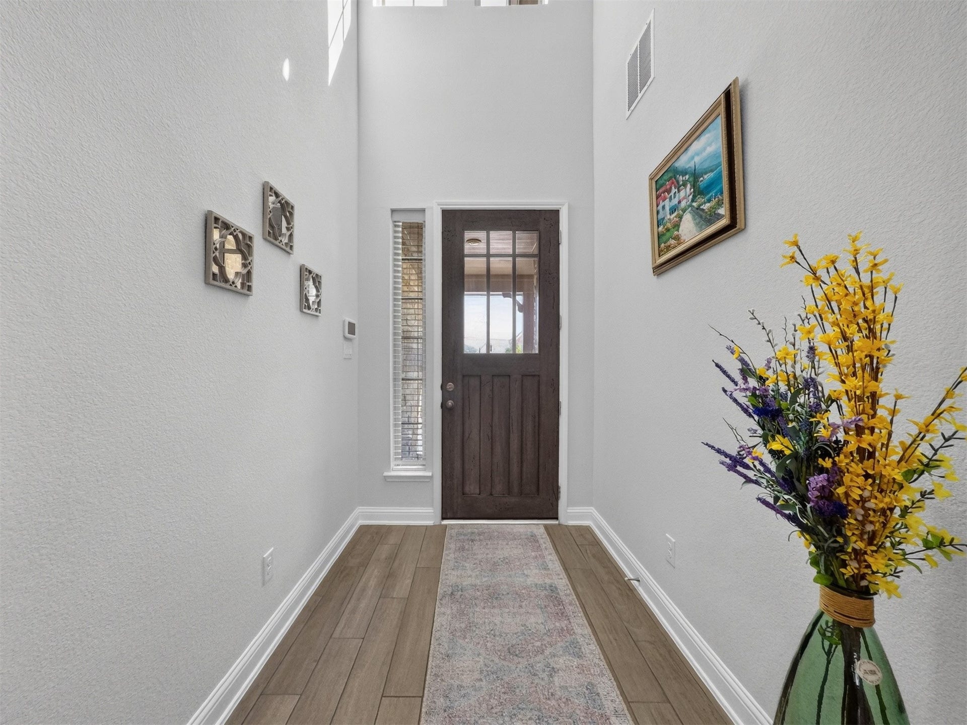 15419 Wilsons Snipe Court, Cypress, TX 77433 Step inside to an impressive entry with soaring ceilings, neutral colors and durable wood-look tile flooring that continues through the main living areas.