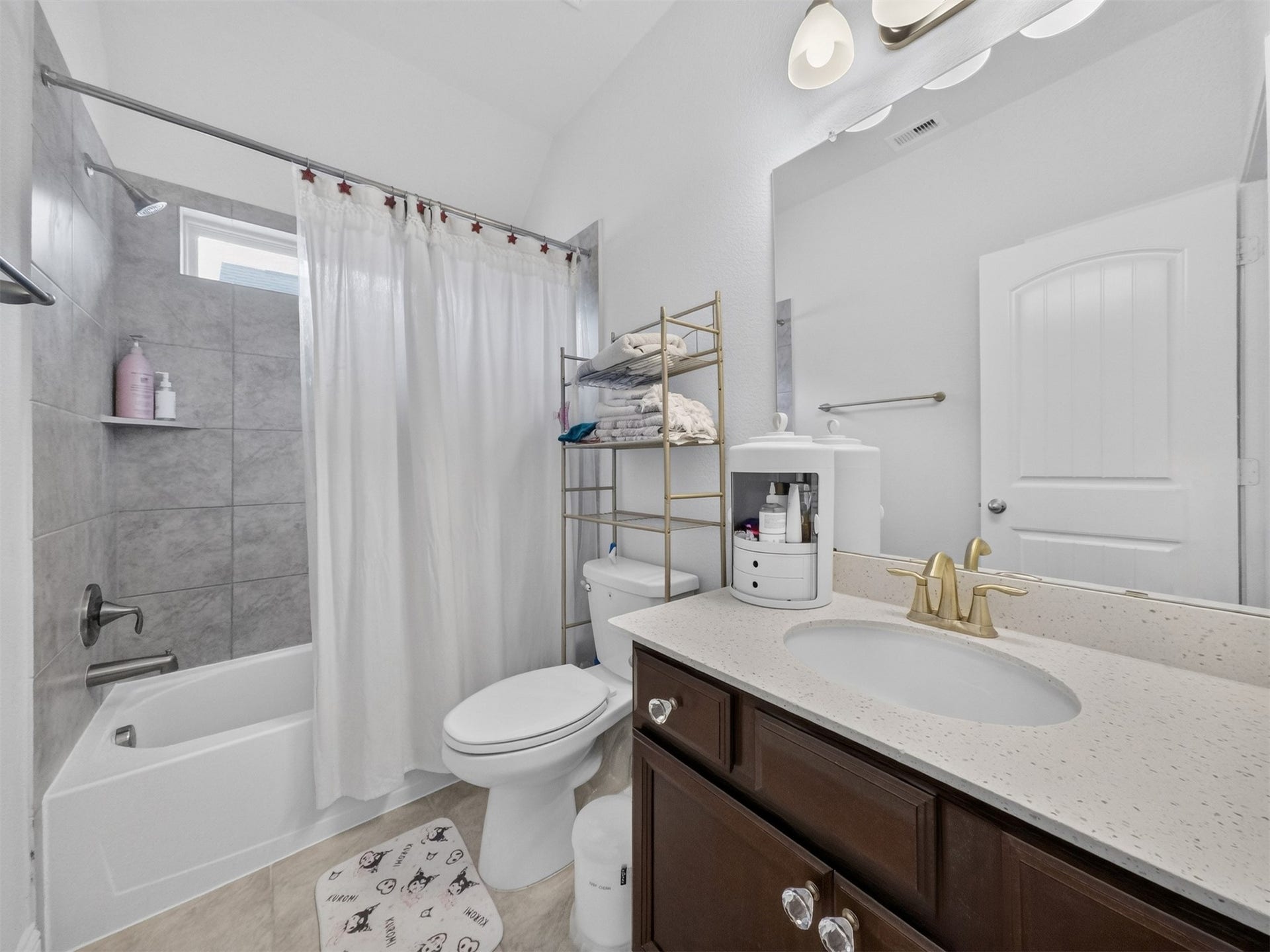 15419 Wilsons Snipe Court, Cypress, TX 77433 Guests upstairs have a full bathroom of their own with quartz counters, attractive tile work, natural light and a cleverly hidden linen closet behind the door.