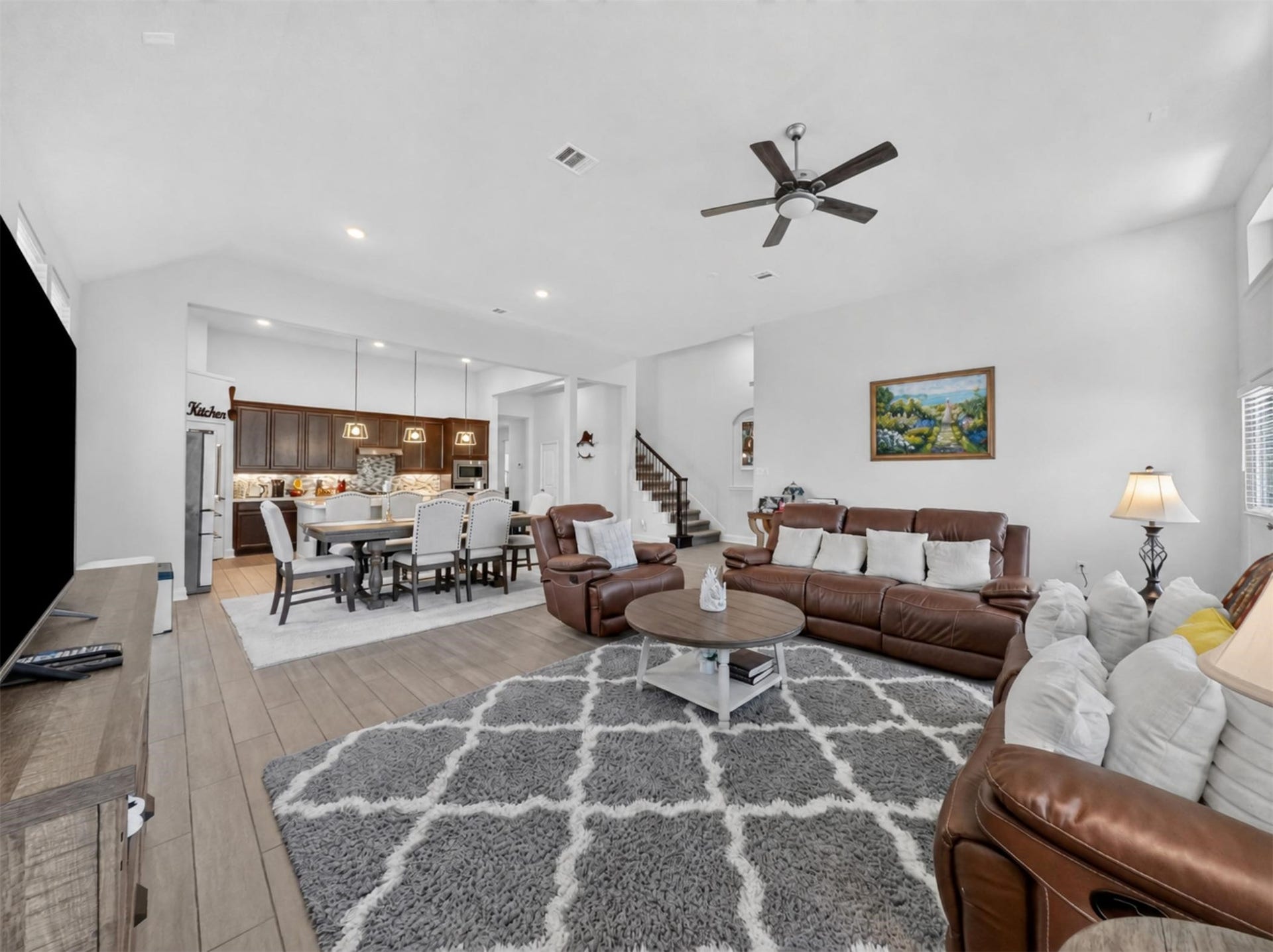 15419 Wilsons Snipe Court, Cypress, TX 77433 The open family room gives you space for comfortable everyday seating while still leaving plenty of room when the guest list grows.