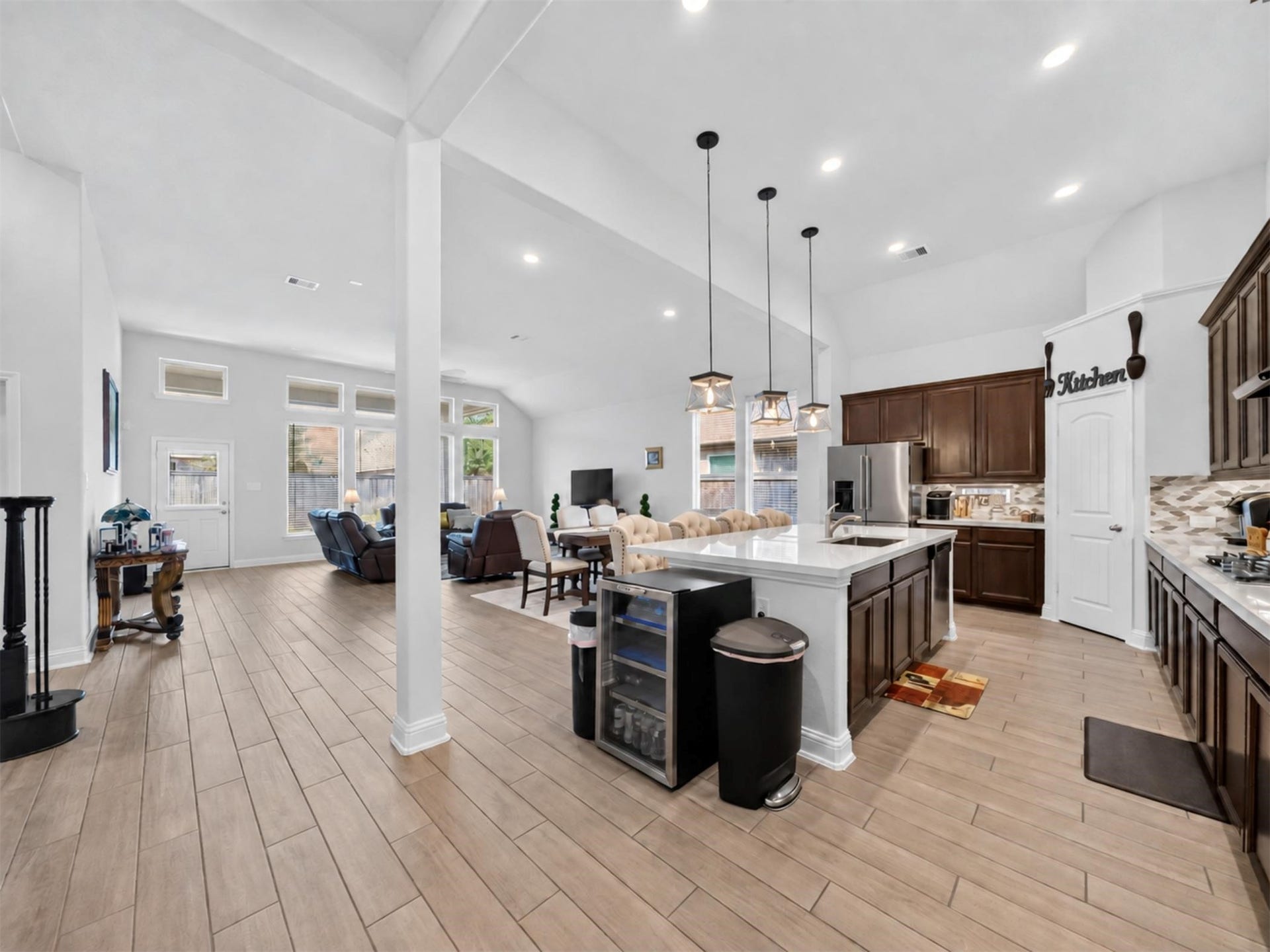 15419 Wilsons Snipe Court, Cypress, TX 77433 This is where the floor plan really comes together. The kitchen, dining and living areas are open to one another, giving everyone plenty of room without feeling disconnected.