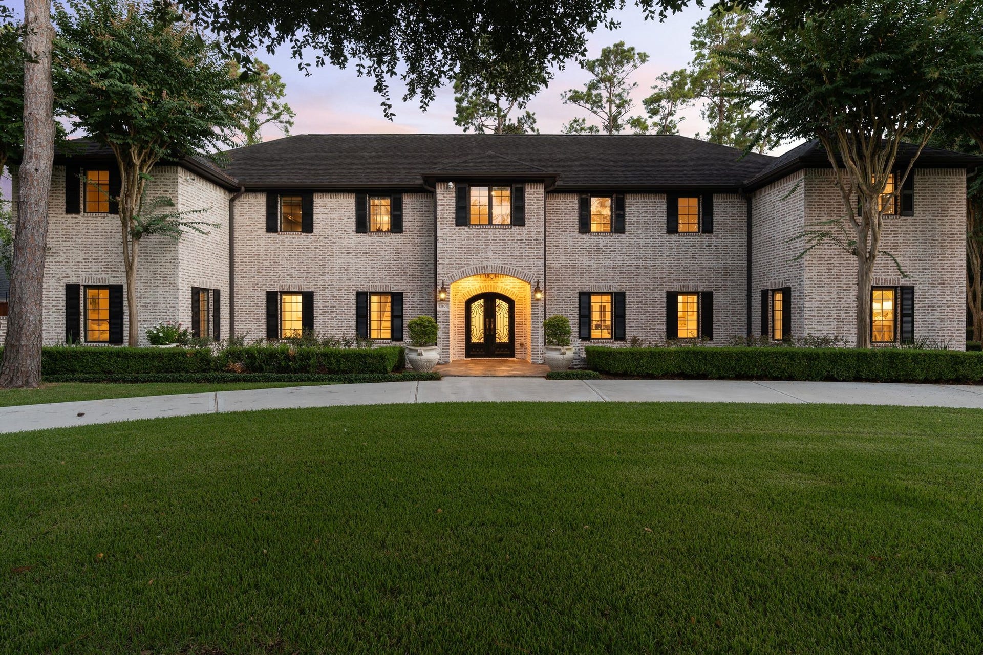 11407 Holidan Way, Hedwig Village, TX 77024 Stunning front exterior highlighting the homes stately recent German smear exterior (spring '26), circular drive & mature landscaping. All creating an inviting first impression. Seller has comprehensive documentation of the extensive renovations, including plans, permits and supporting documentation, and is happy to make these materials available to serious buyers upon request.