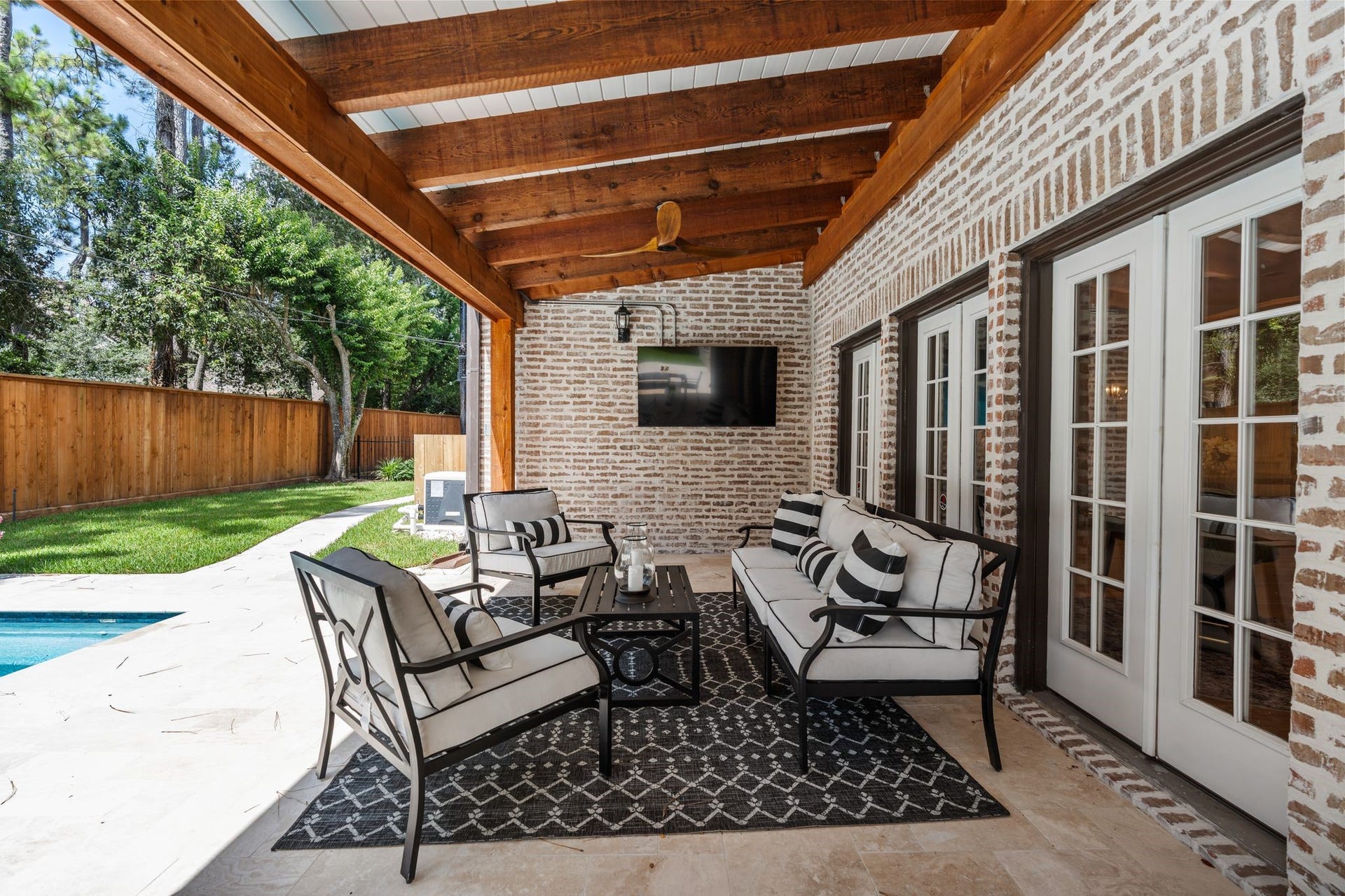 11407 Holidan Way, Hedwig Village, TX 77024 Designed for effortless outdoor living, the expansive covered patio offers a beautiful setting for dining, lounging & entertaining family and friends. An outdoor TV remains w/ the home, adding to the spaces year-round functionality.