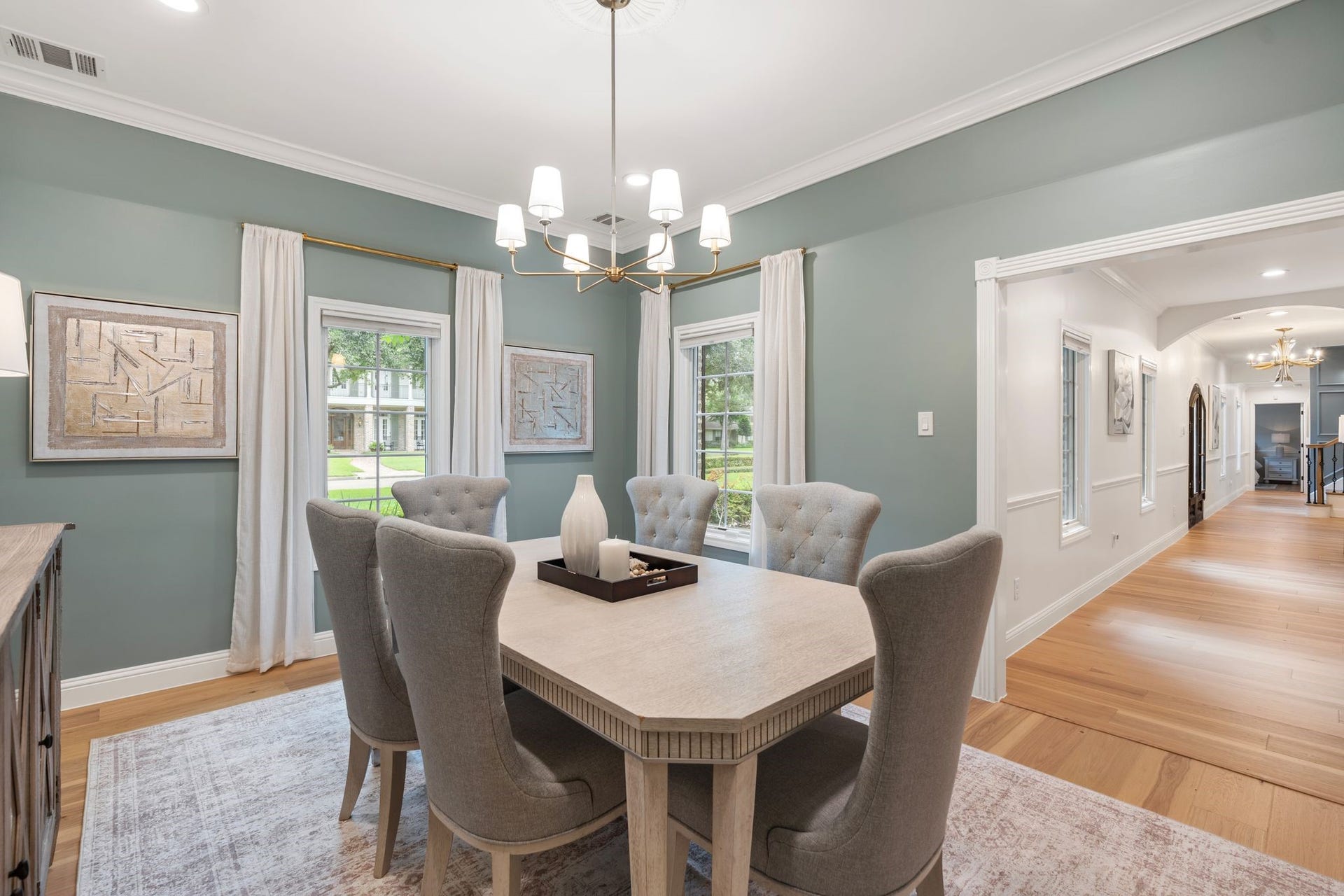 11407 Holidan Way, Hedwig Village, TX 77024 Light filled formal dining room connects effortlessly to the entry. Features a decorative light fixture, crown molding, drapes & recessed canless lighting; creating an elegant setting for hosting family & friends.