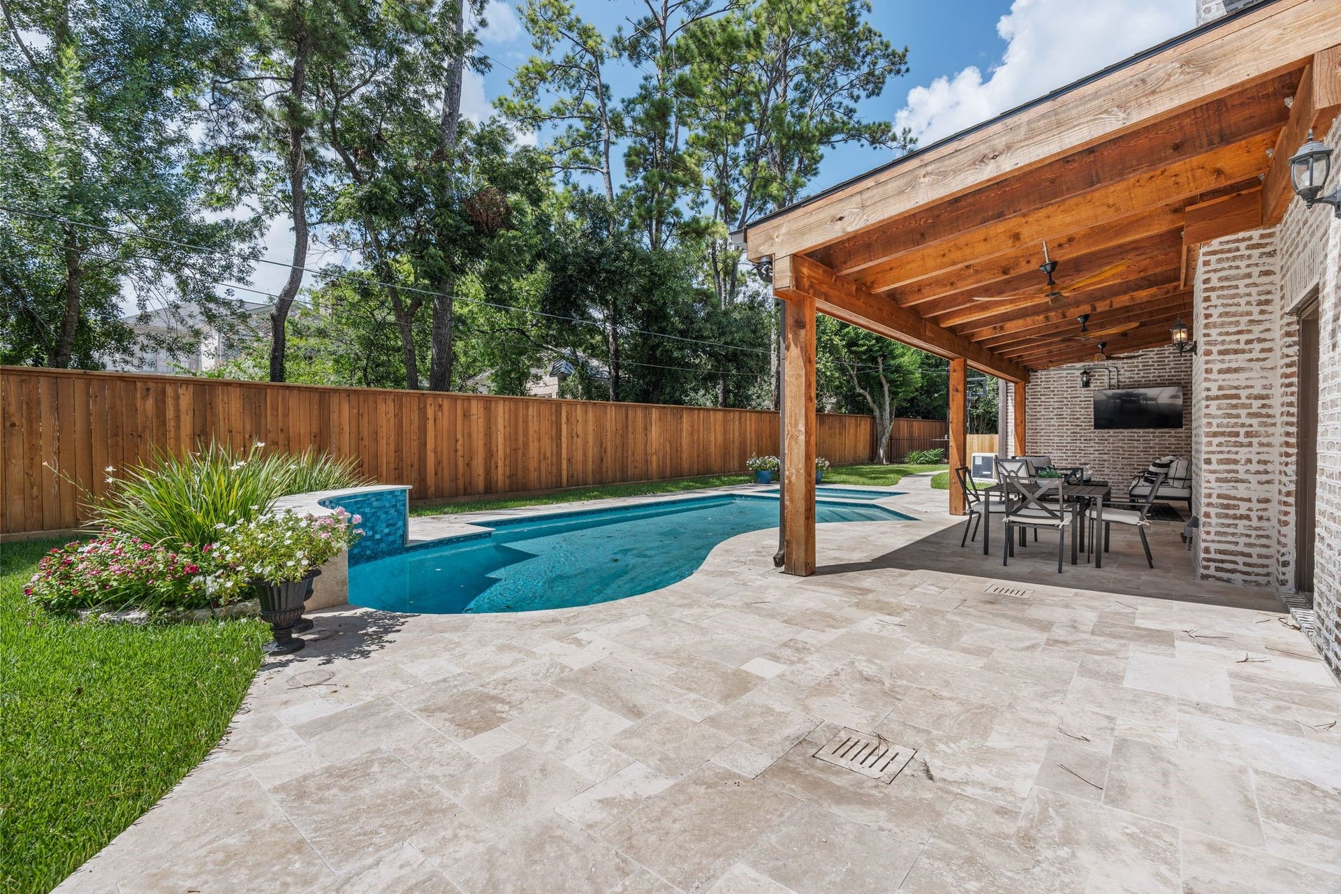 11407 Holidan Way, Hedwig Village, TX 77024 Expansive patio offers plenty of room for outdoor furnishings and pool loungers. Ample space for outdoor enjoyment. Fully-fenced backyard.