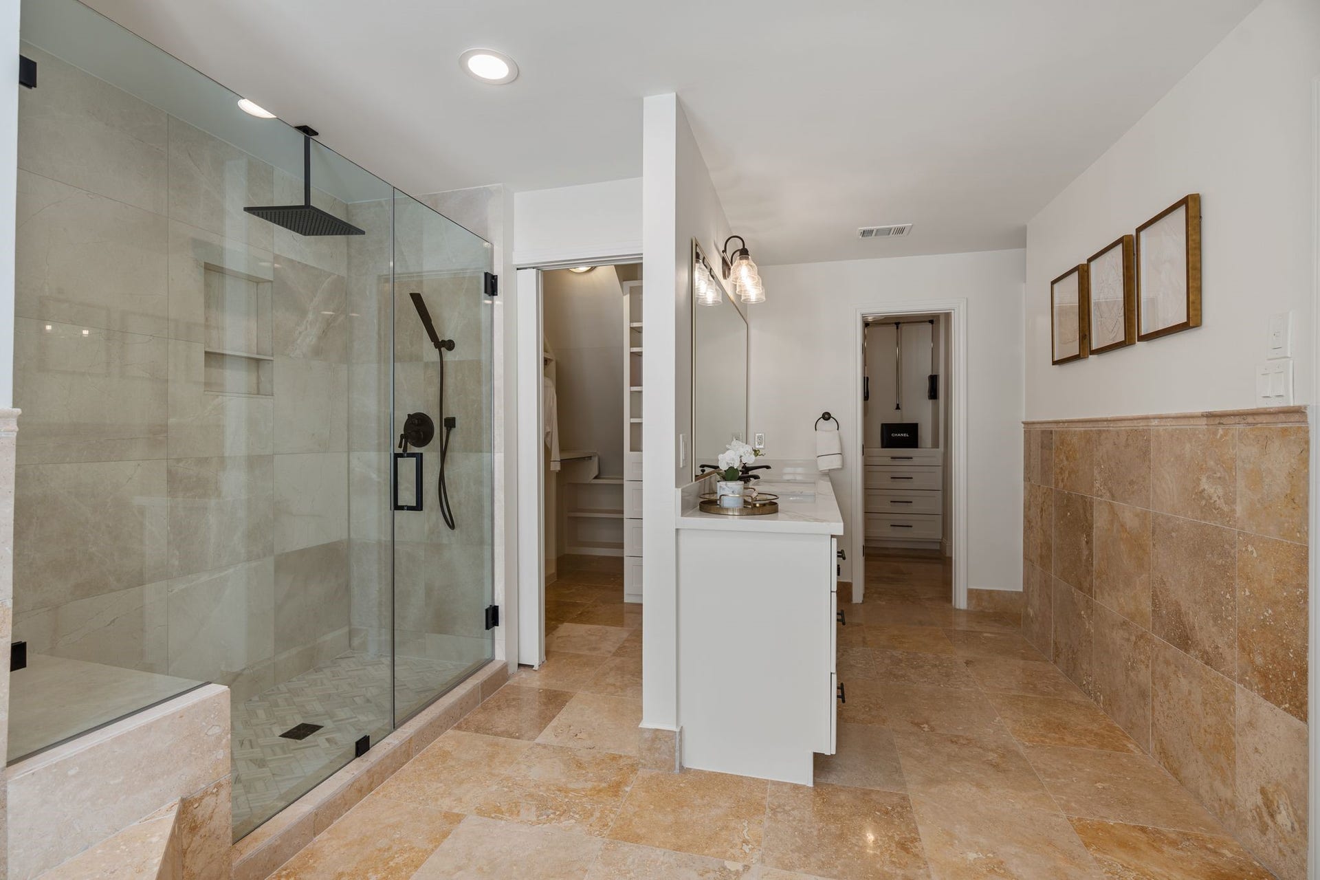 11407 Holidan Way, Hedwig Village, TX 77024 Another view of the extensively remodeled primary bath showcasing its generous scale & thoughtful storage. Dual closets w/ built-ins were remodeled in 2025, complemented by a dedicated linen closet for additional organization.