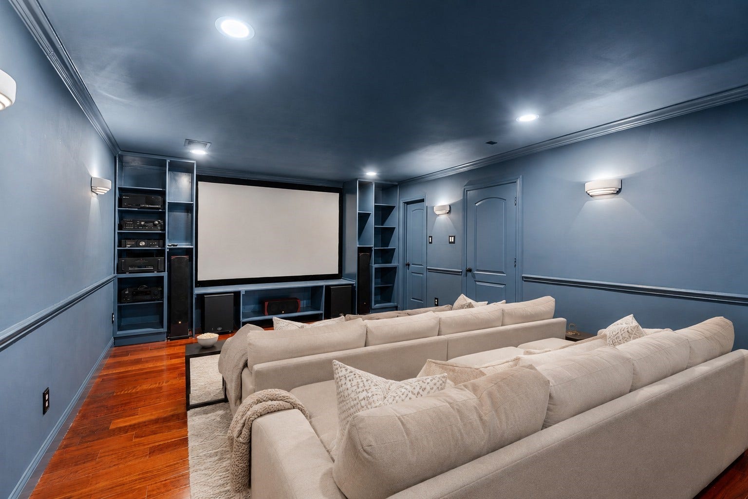 11407 Holidan Way, Hedwig Village, TX 77024 Spacious dedicated theatre/media room located upstairs just off the second-floor landing. Large projection screen w/ built-in surround sound, ceiling-mounted HD projector & Monitor Audio theater speakers create an incredible setting for movie nights. Custom built-ins flank the screen, while in-wall wiring leads to a spacious dedicated AV closet for concealed equipment & easy access. Virtually staged. Theater equipment remains w/ the home.