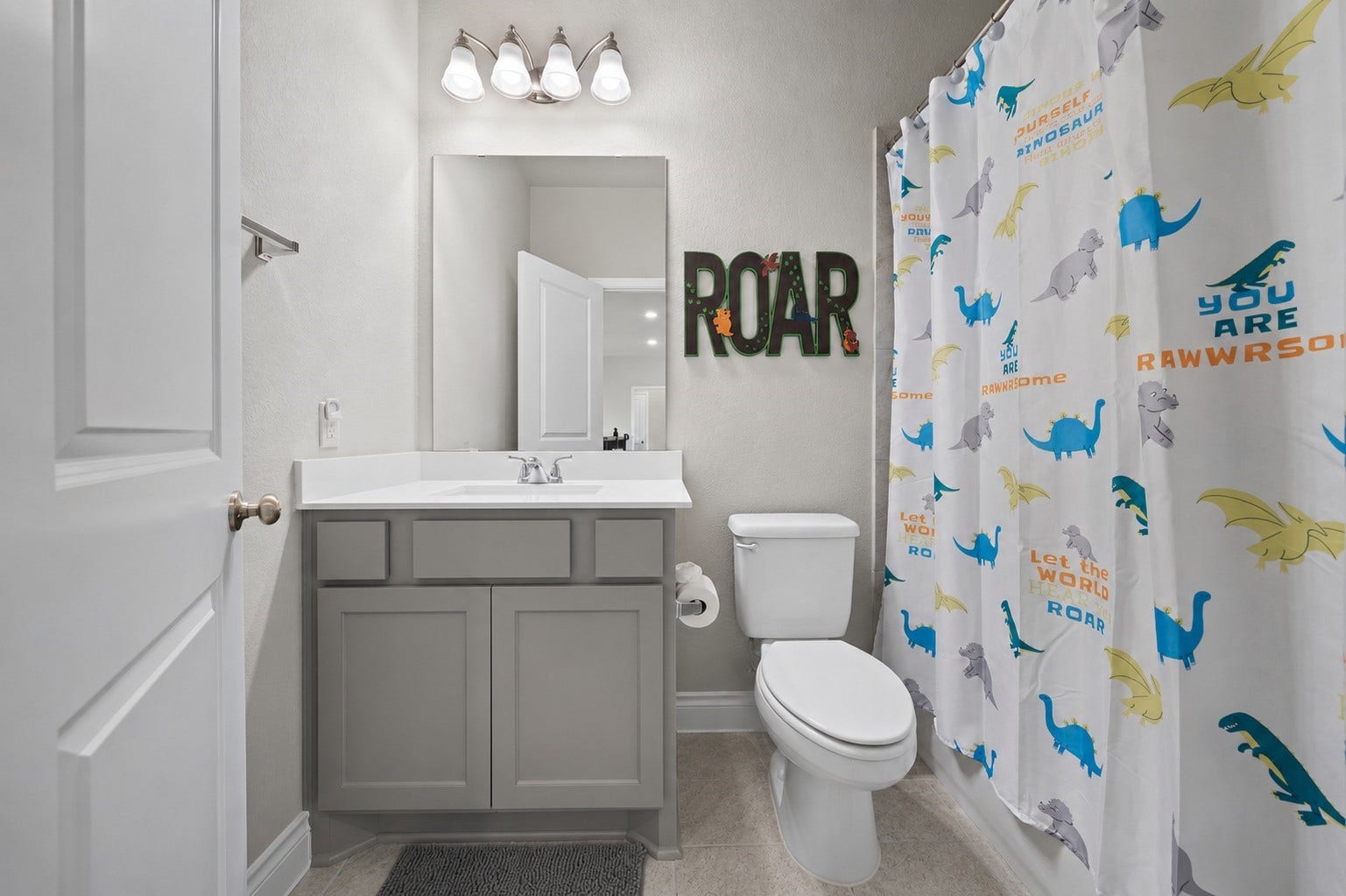 6902 N Elmwood Trail, Katy, TX 77493 A third fresh and functional bathroom with a stylish vanity, neutral finishes and a classic tub/shower combo.